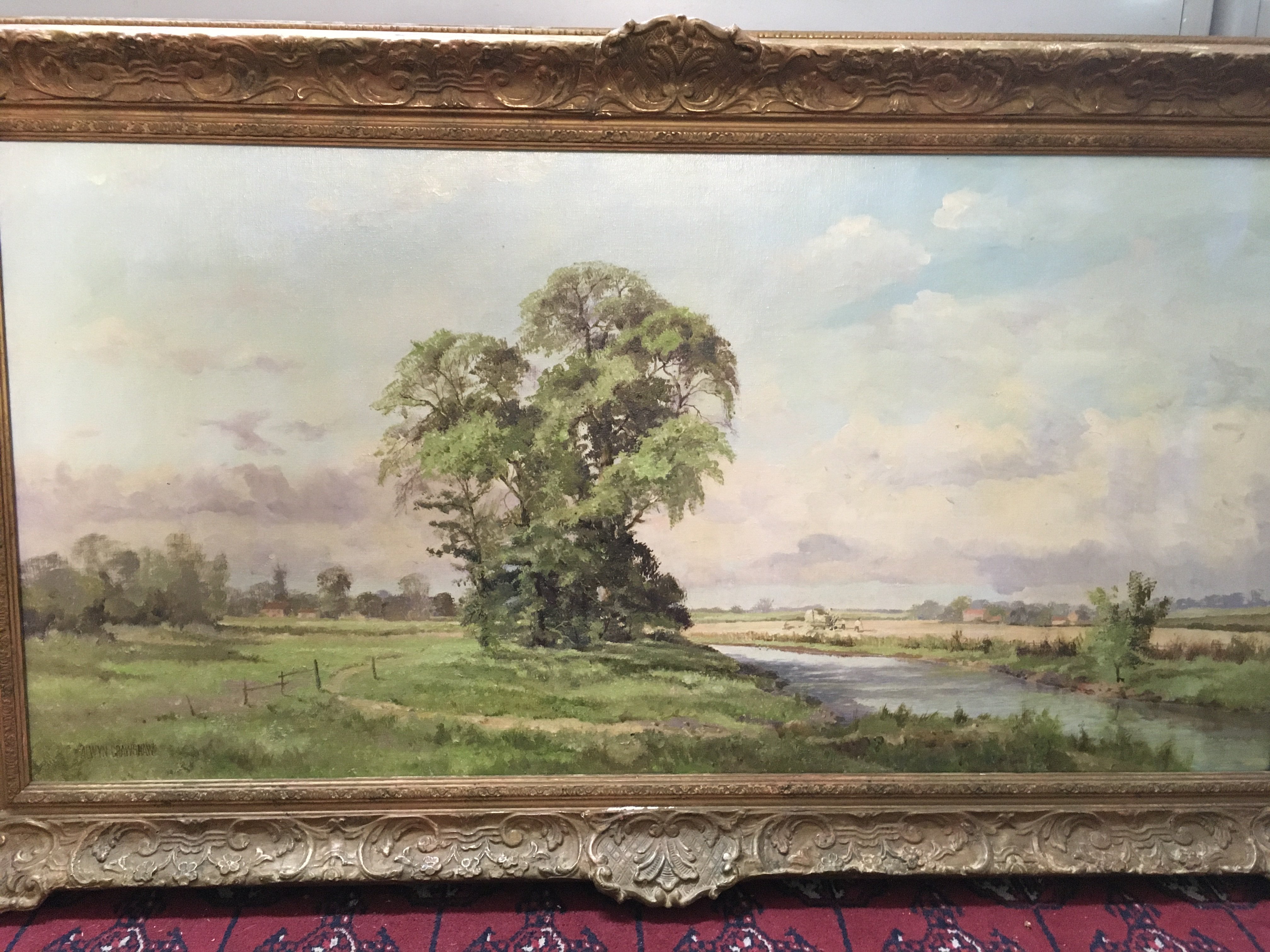 A 20th century Alwyn Crawshaw framed oil on canvas painting depicting a English rural scene. Frame dimensions 119x68cm