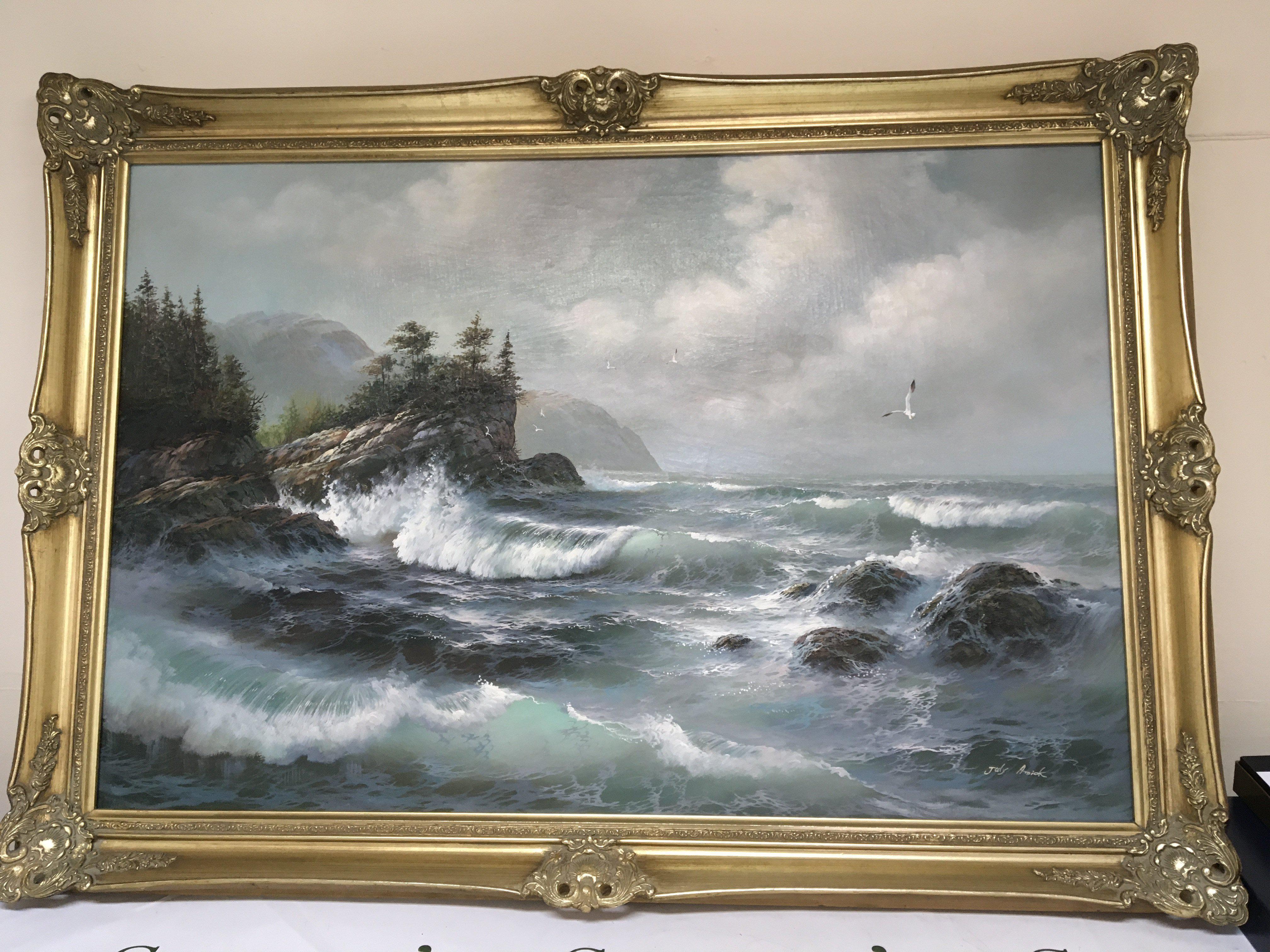 A Gilt framed oil painting on canvas study of breaking waves across a rocky shore signed July Amrick. NO RESERVE. 104x73cm