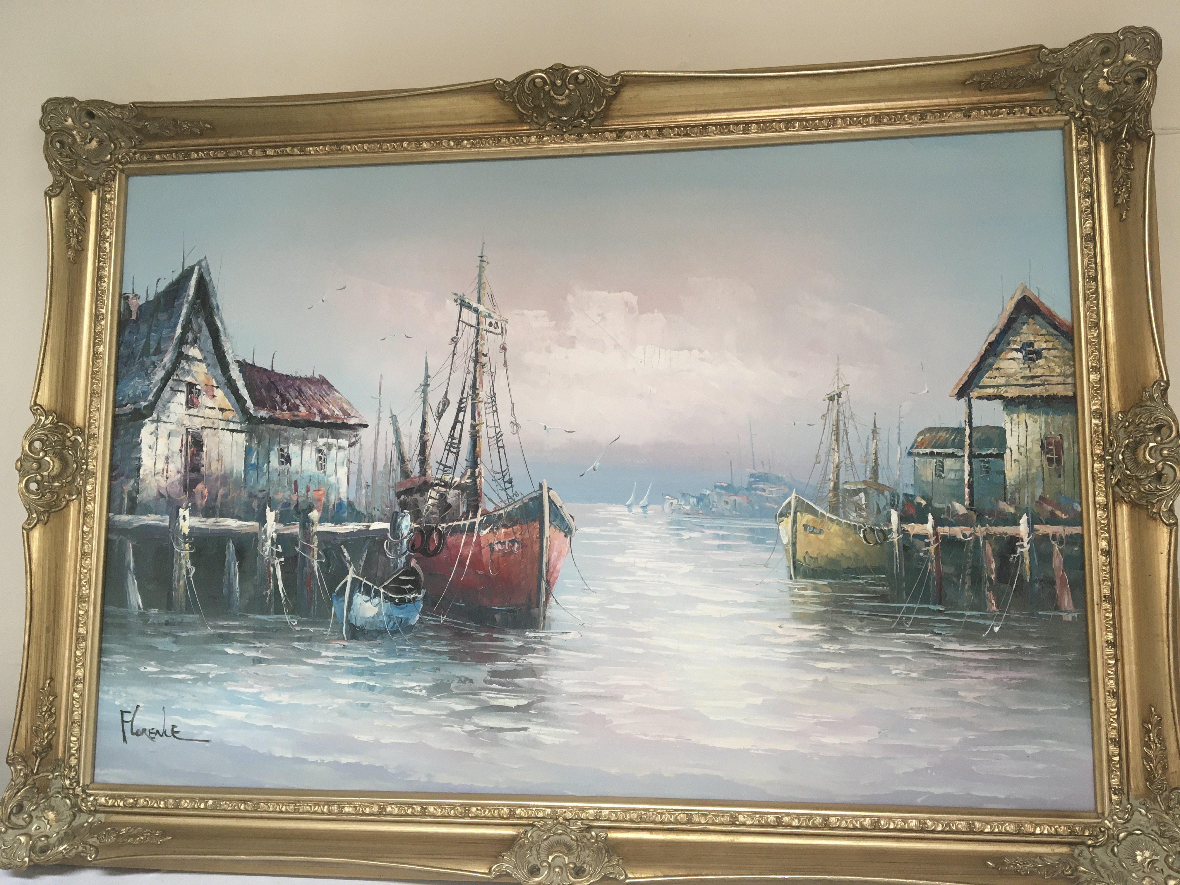 A framed oil painting on canvas study of moored sailing boats signed Florence. In a gilt frame. No Reserve. 95x75cm