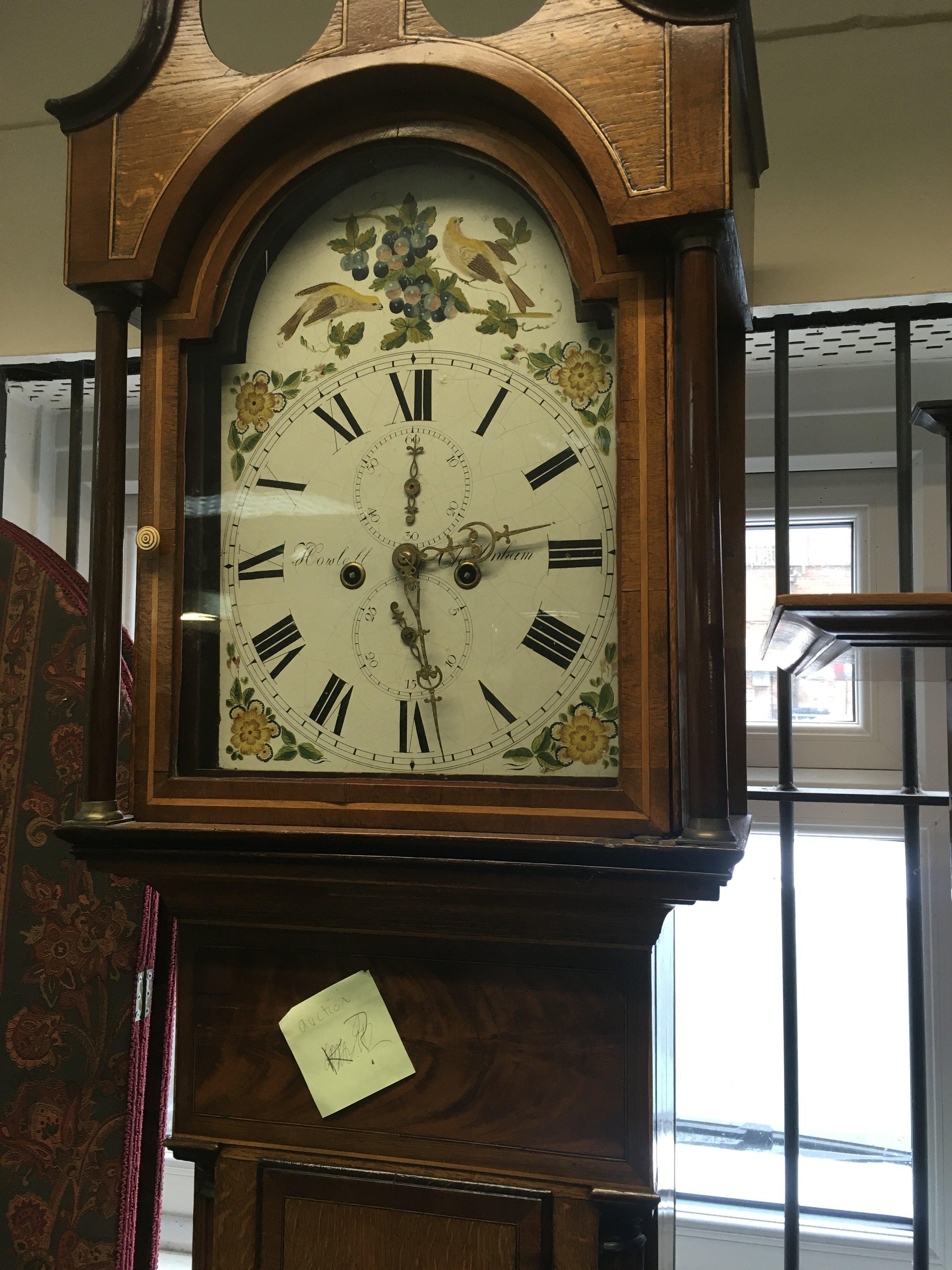 A mahogany long case clock the painted dial with Roman numerals-