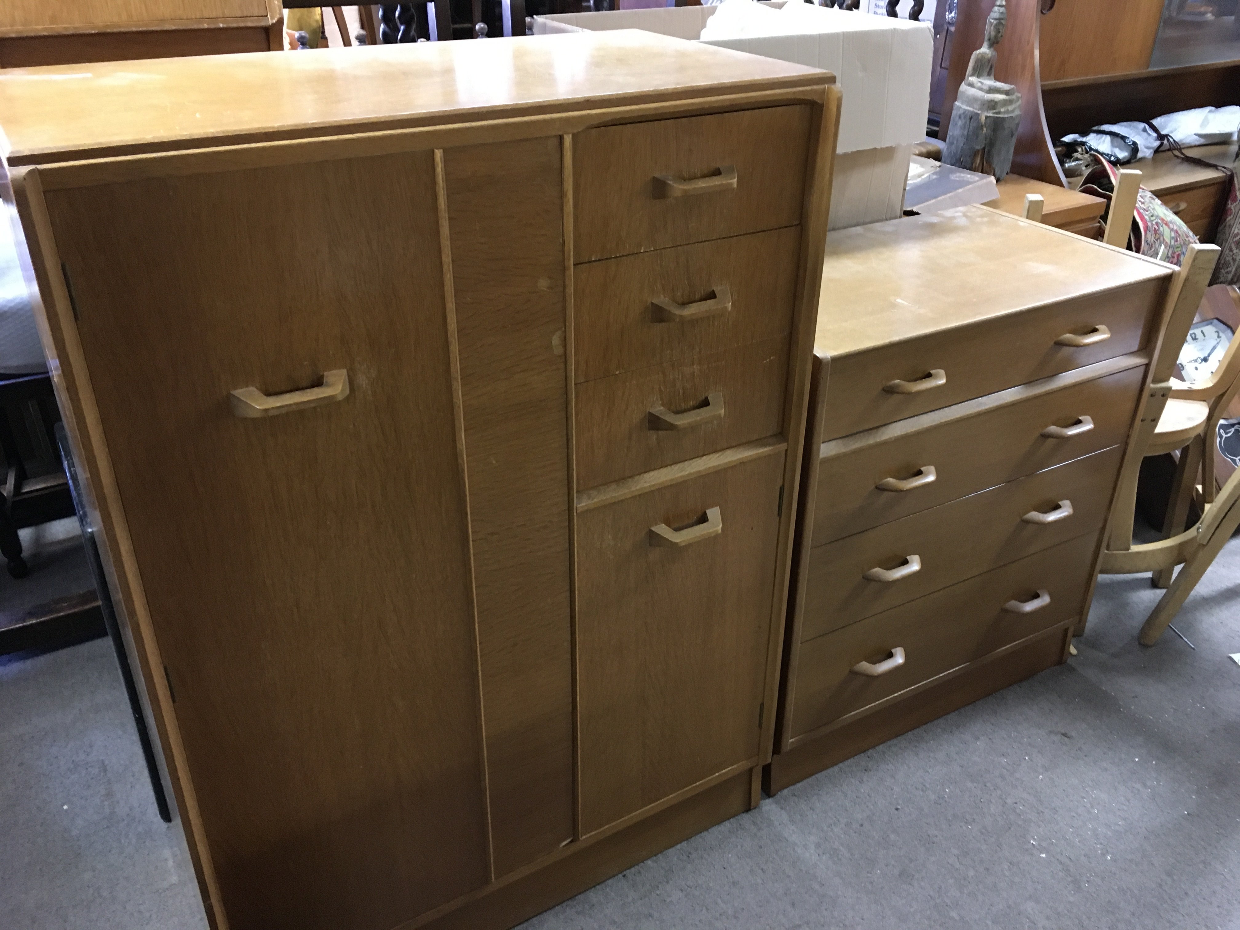 A mid 20th century oak G Plan chest of drawers (76cm wide 84cm tall) , Gentlemens wardrobe (88cm wide 122cm tall, and a pair of bedside tables .
