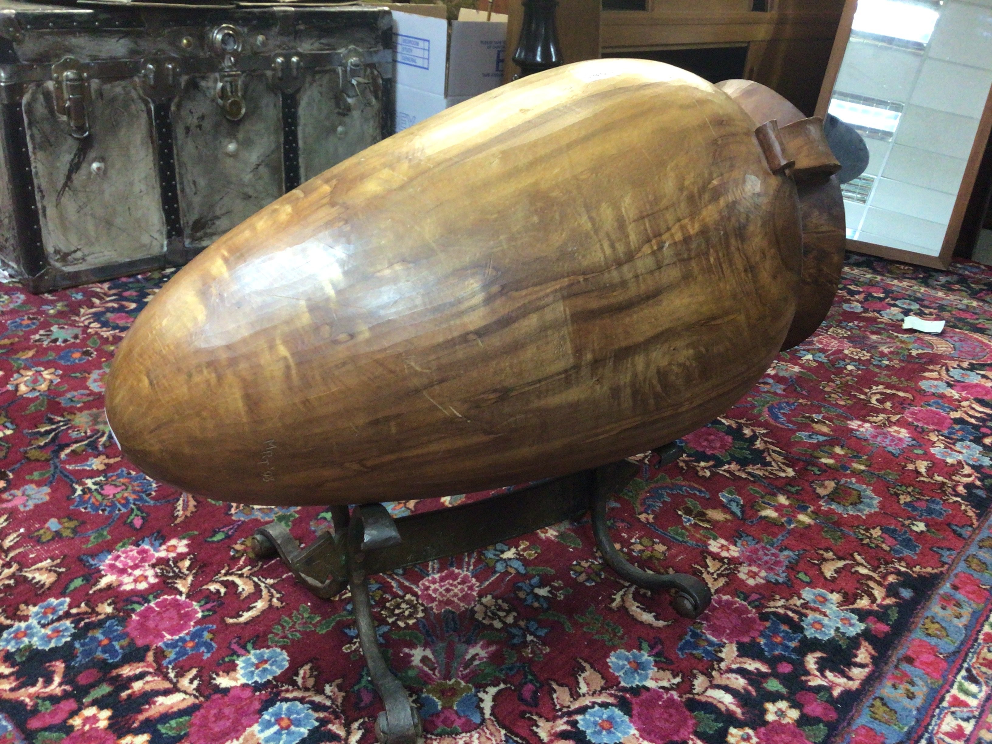 An unusual large carved wood Vessel on a crafted bispoke wrought metal copper stand. Length 80cm- NO RESERVE