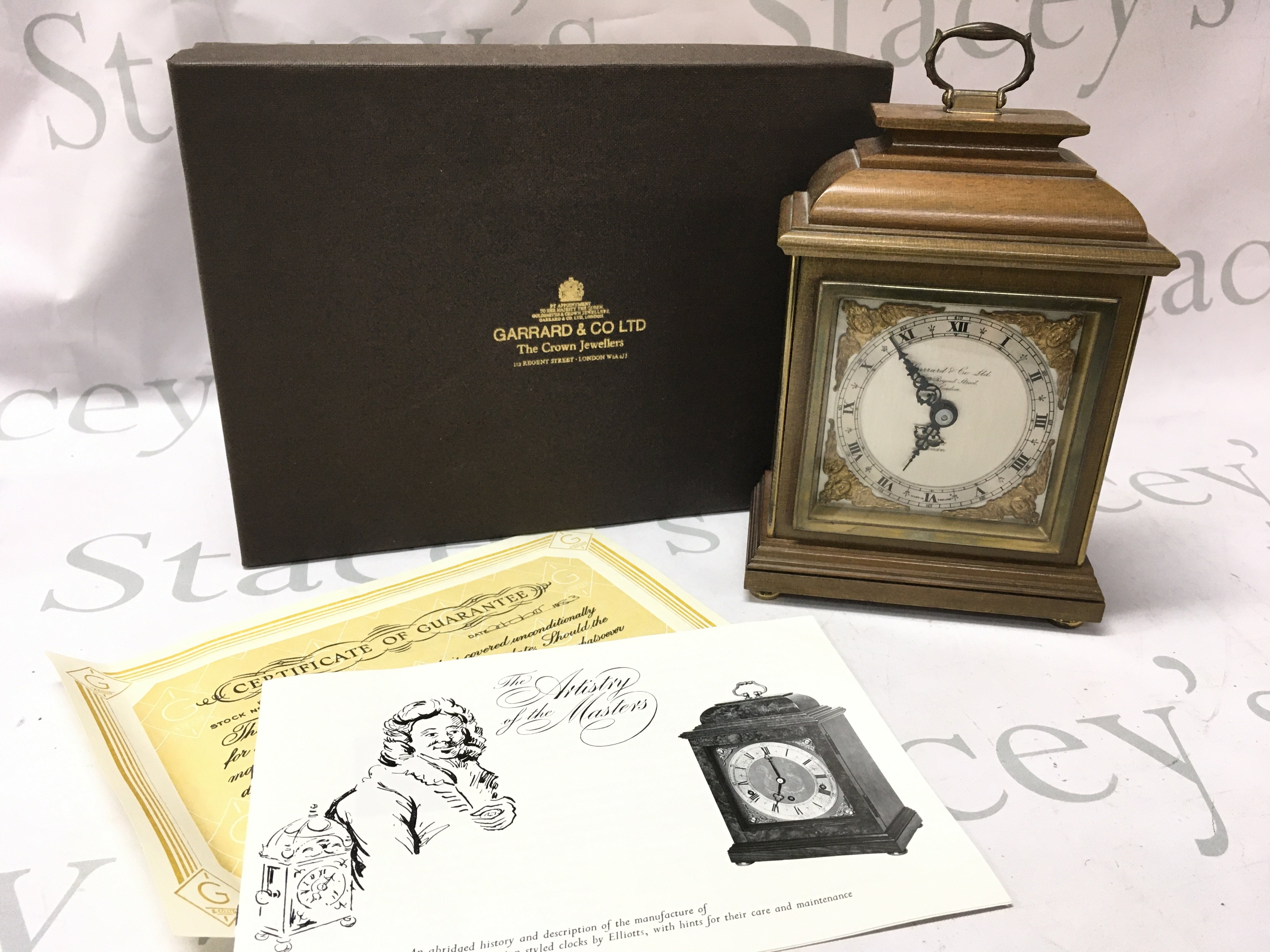 A boxed Garrard mantle clock . Postage category C