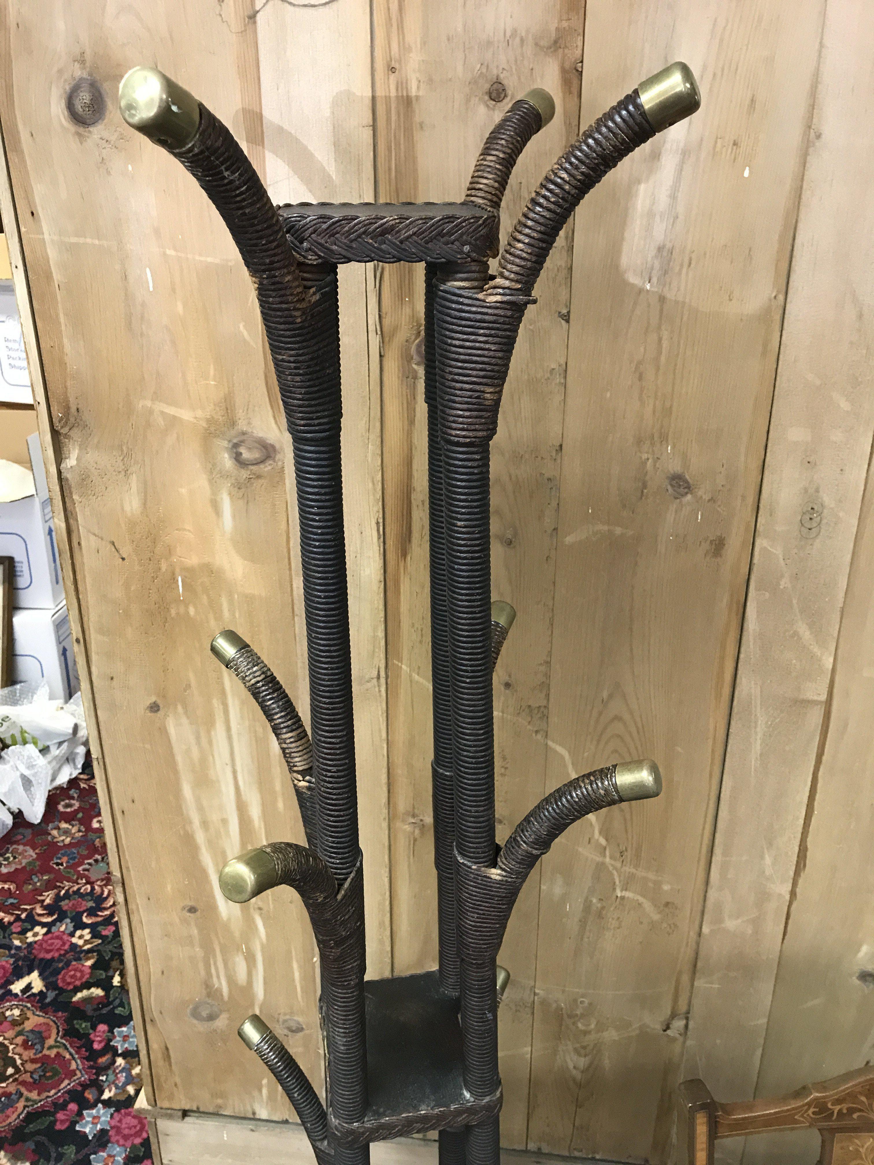 A wicker coat stand United with three tiers.