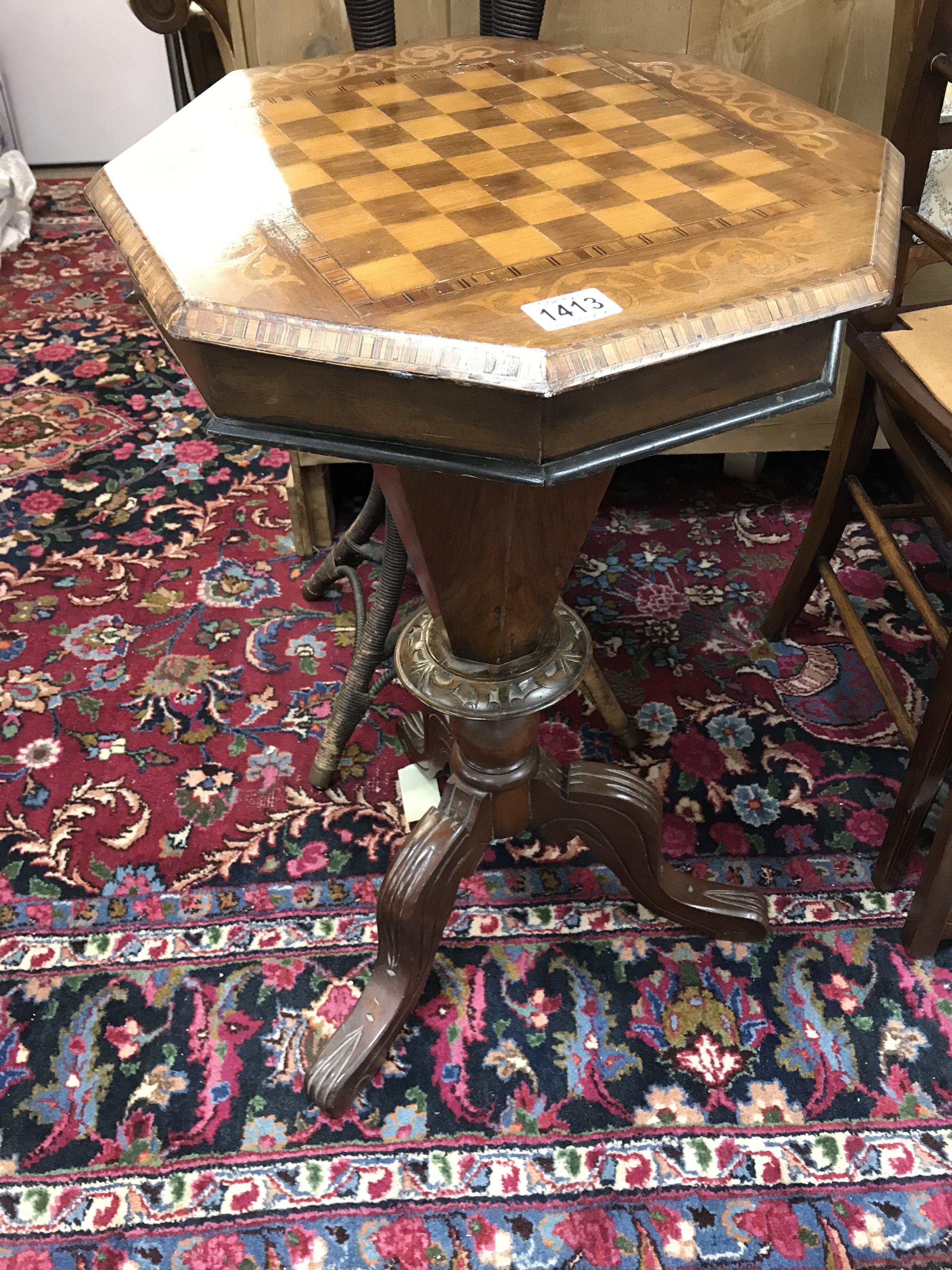A Victorian trumpet shape work box with games top on cabriole legs