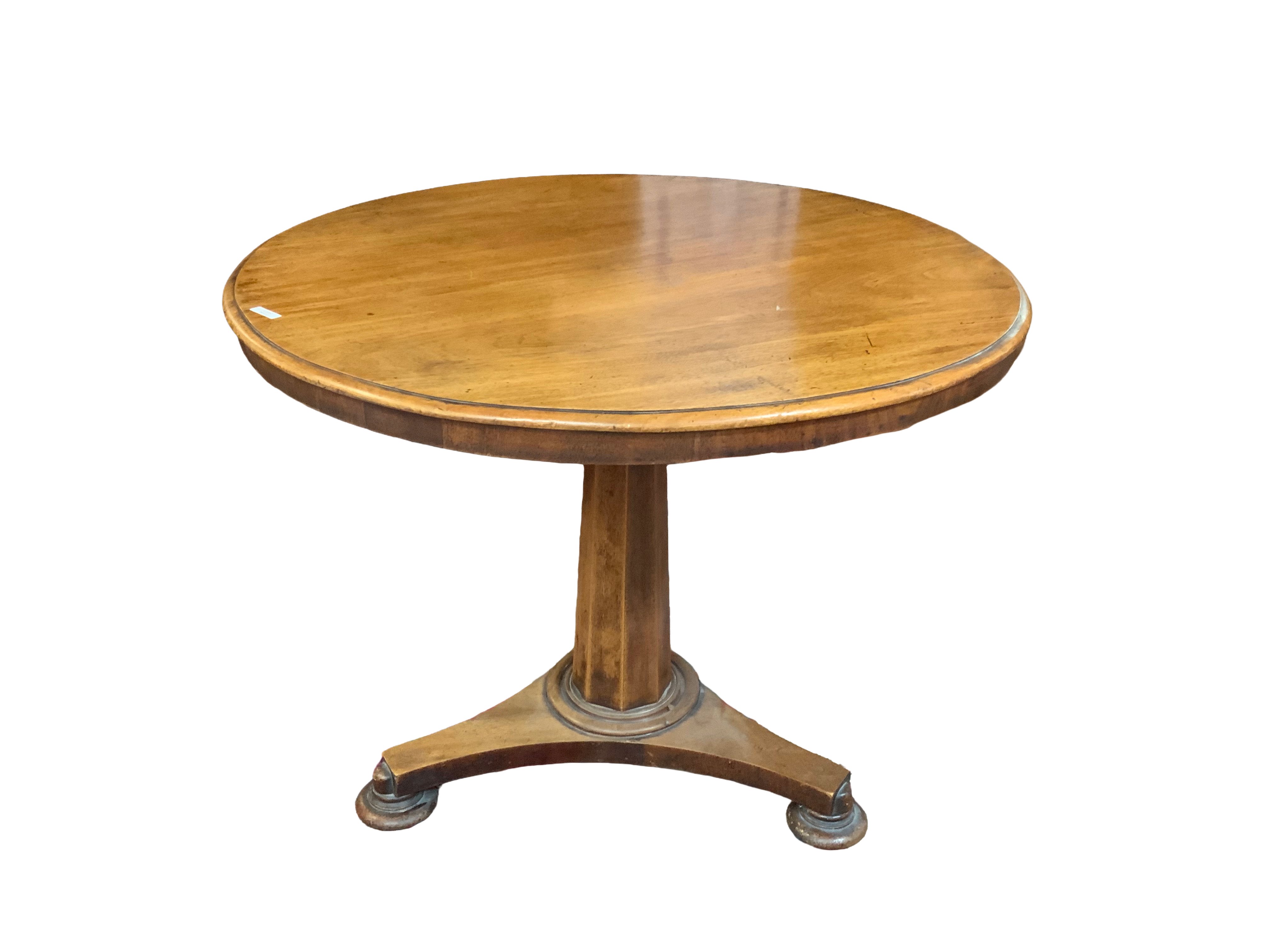 A Victorian Walnut tip top table, diameter 88cm x 67cm.