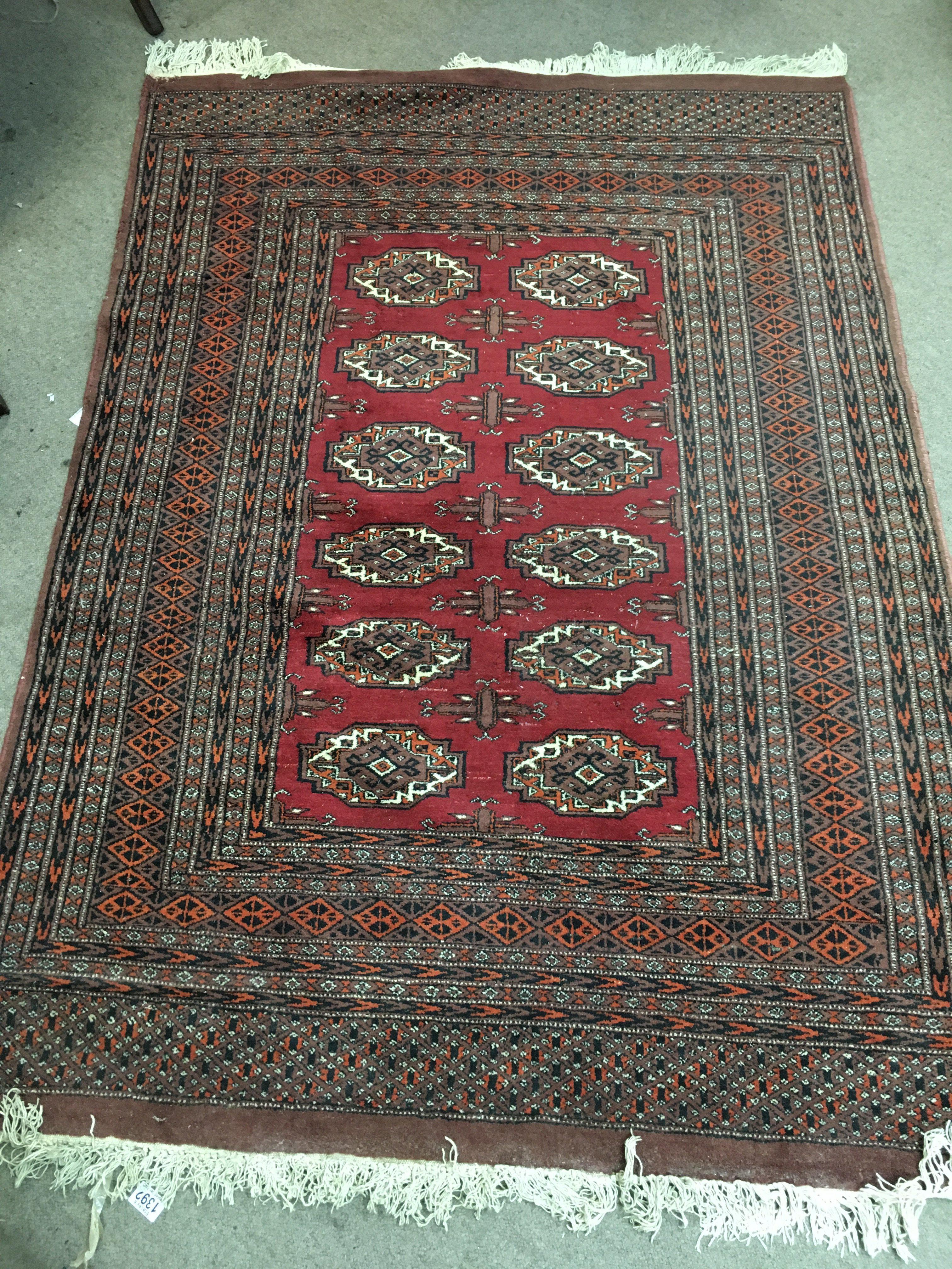 A Persian wool rug. Approx measurements 182x128cm