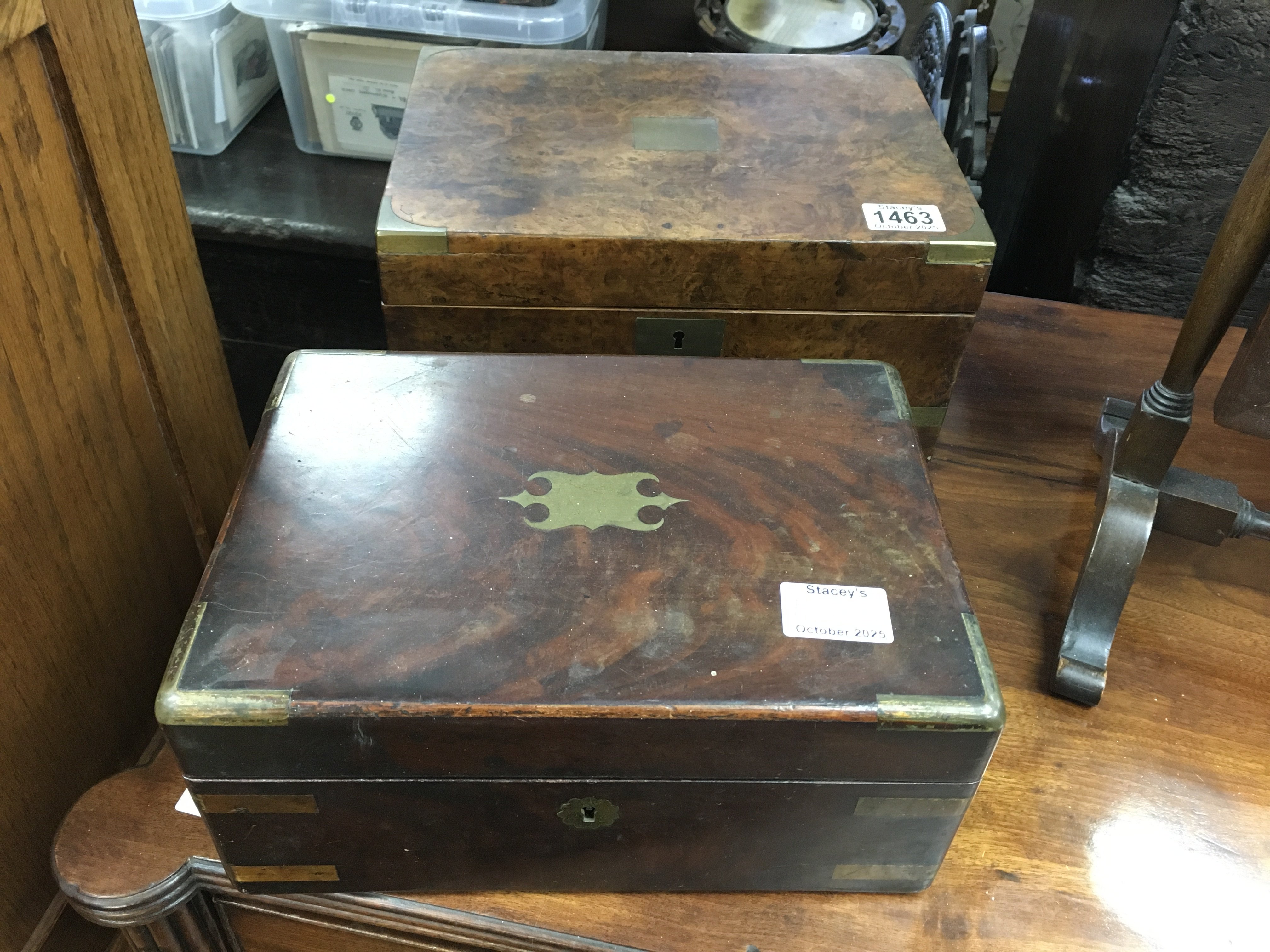 A walnut writing box with fitted interior and a brass bound mahogany box