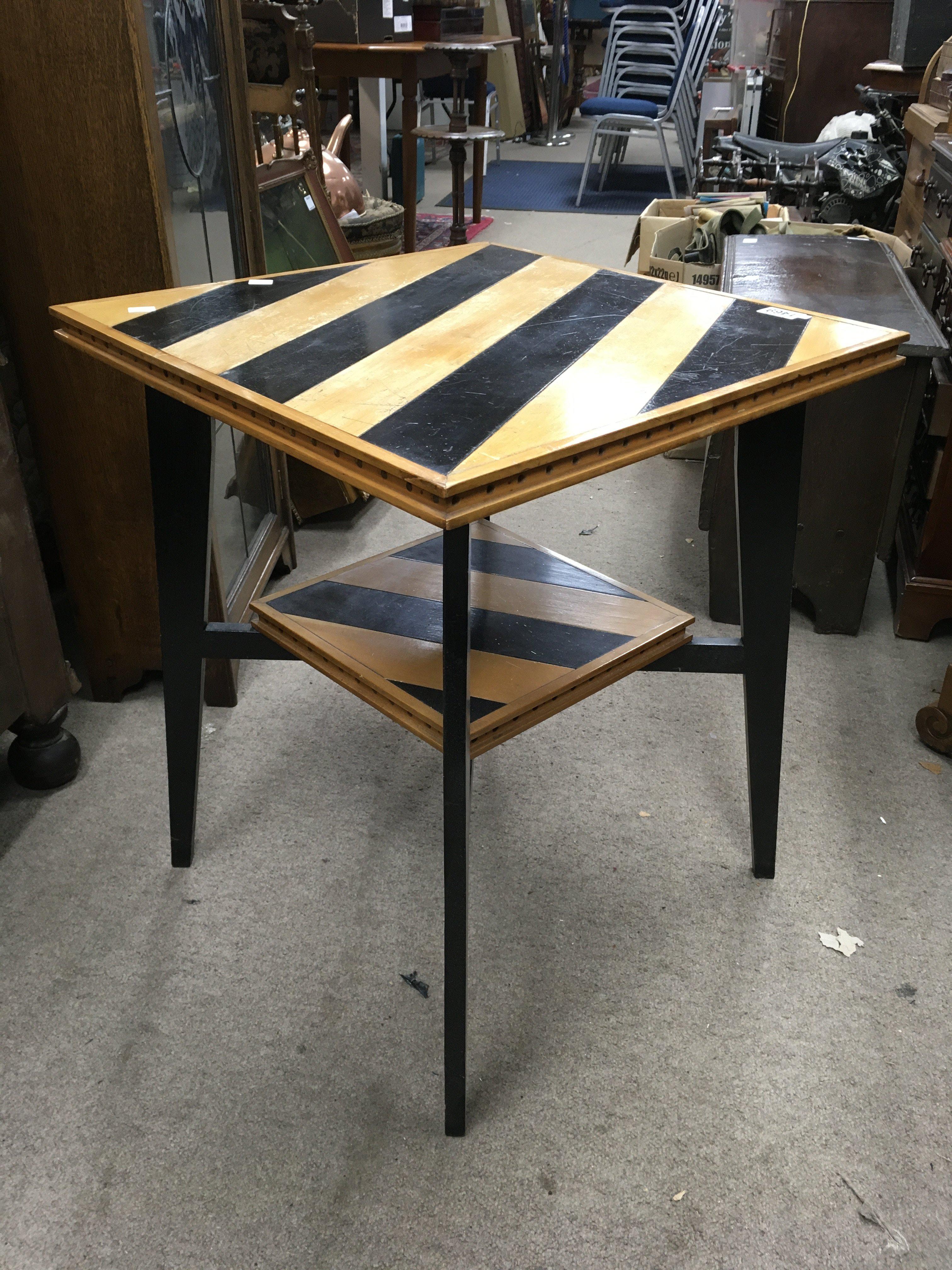 An Art Deco occasional table, the rectangular striped top above square tapering legs, United by an under tier. Attributed to Charles Dudouyt. 62cm x 53cm