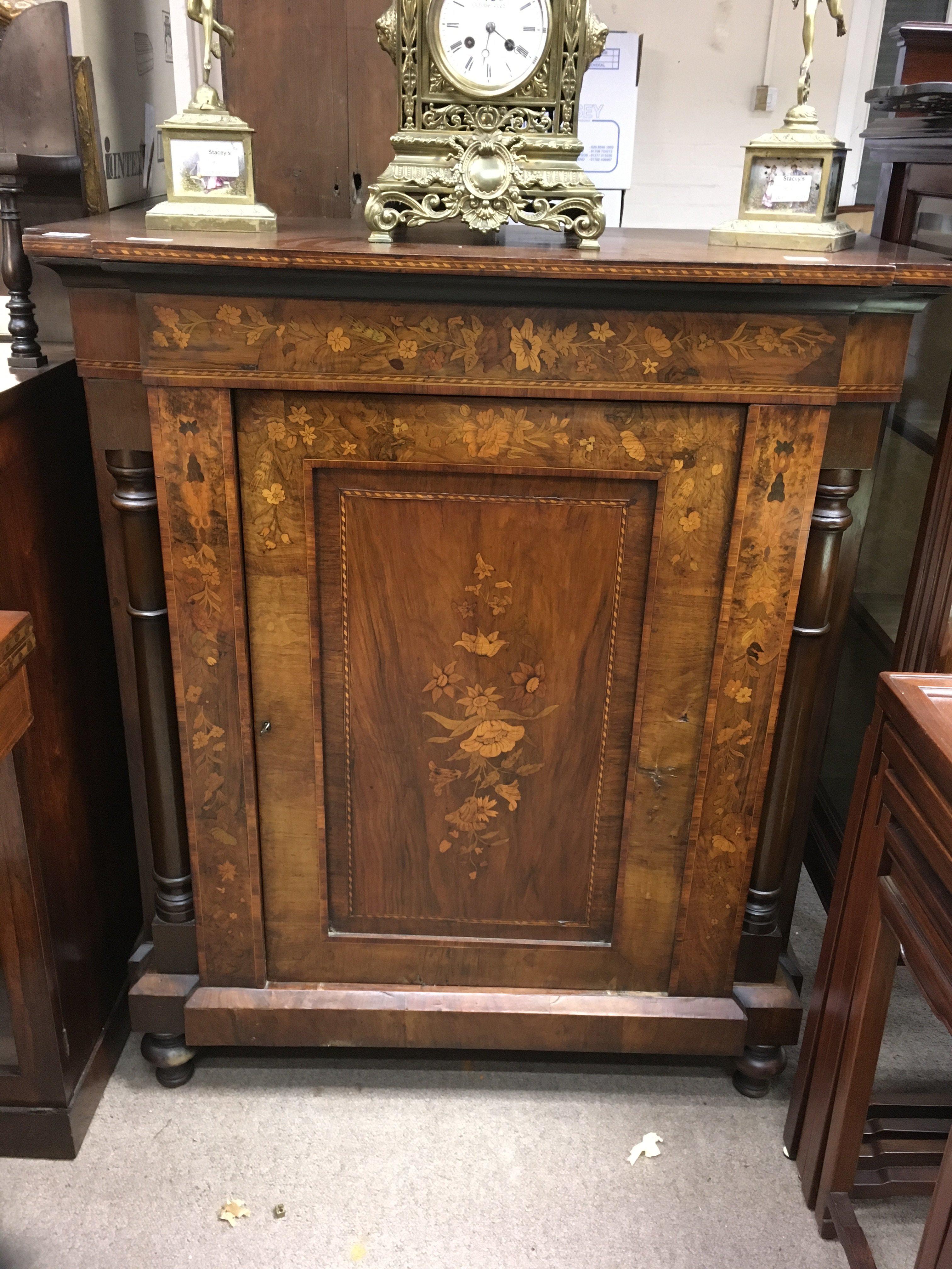 A Victorian walnut inlaid marquetry cabinet, the single door-including a single shelf, on turned feet. 86cm x 40cm