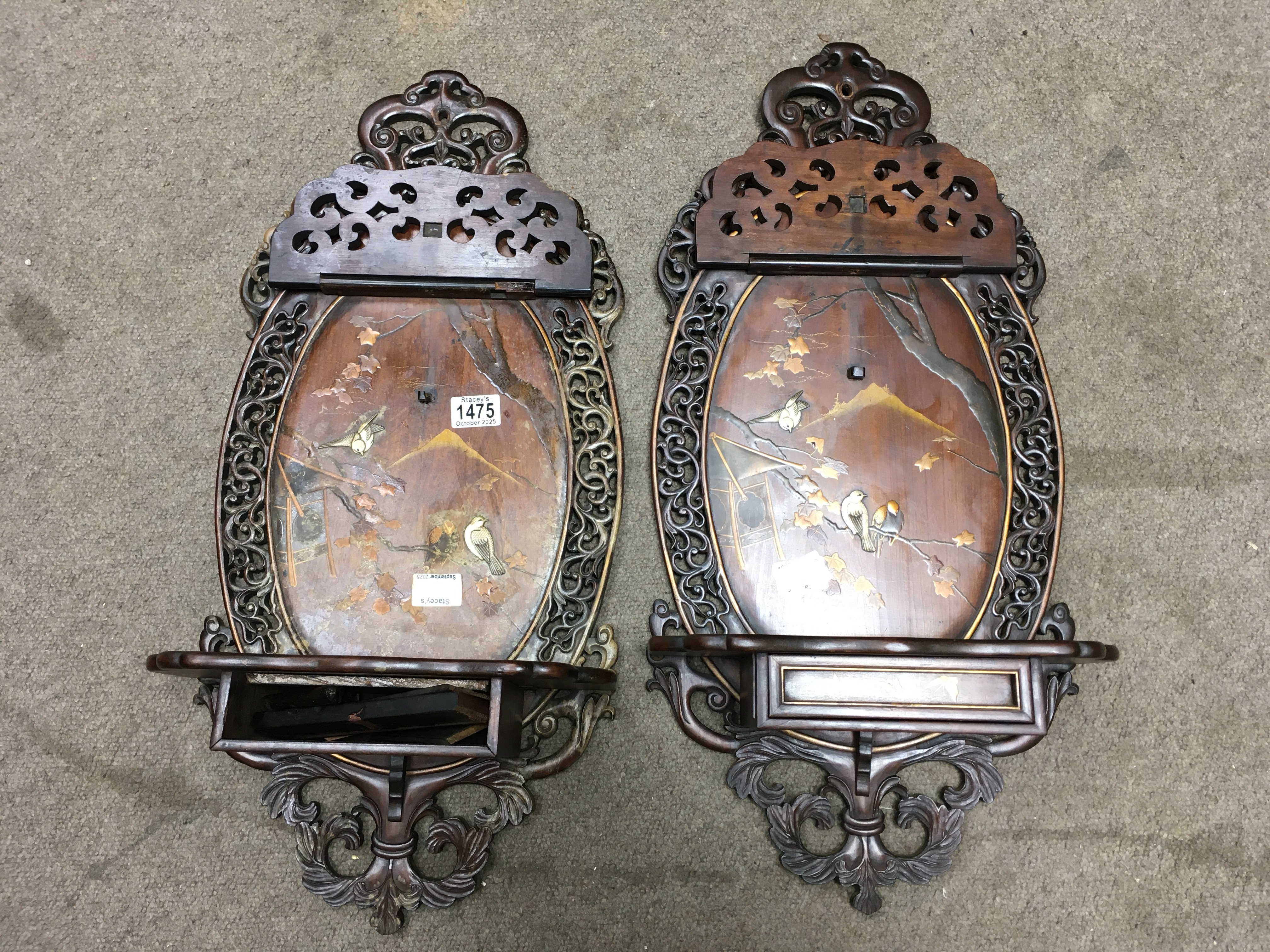 A pair of Victorian mahogany wall brackets inlaid with oriental scenes, with single shelf. 70cm x 32cm