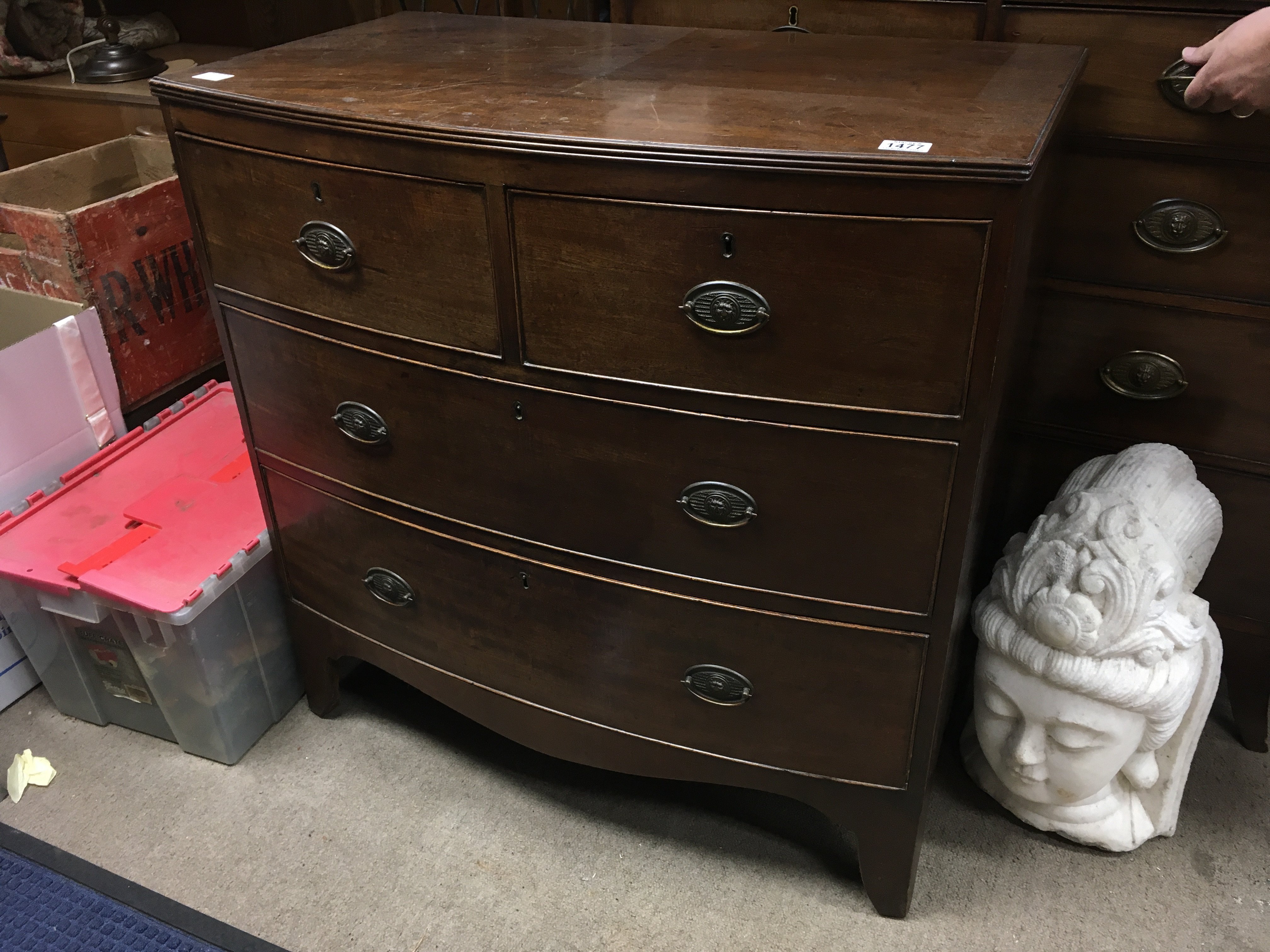A Victorian mahogany bow fronted chest of drawers, fitted with two short and two long drawers