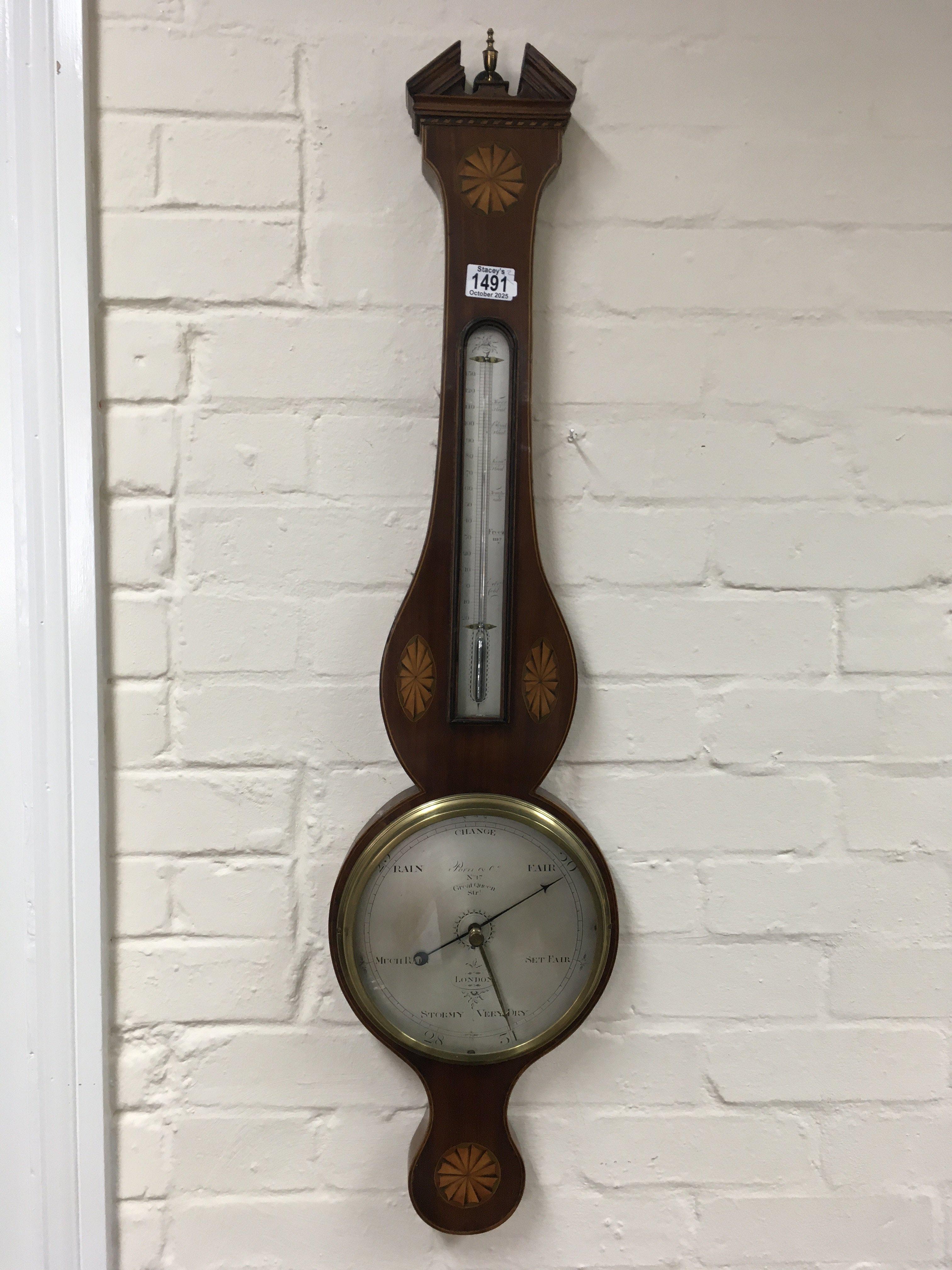 A Georgian mahogany inlaid barometer and a Georgian stick barometer