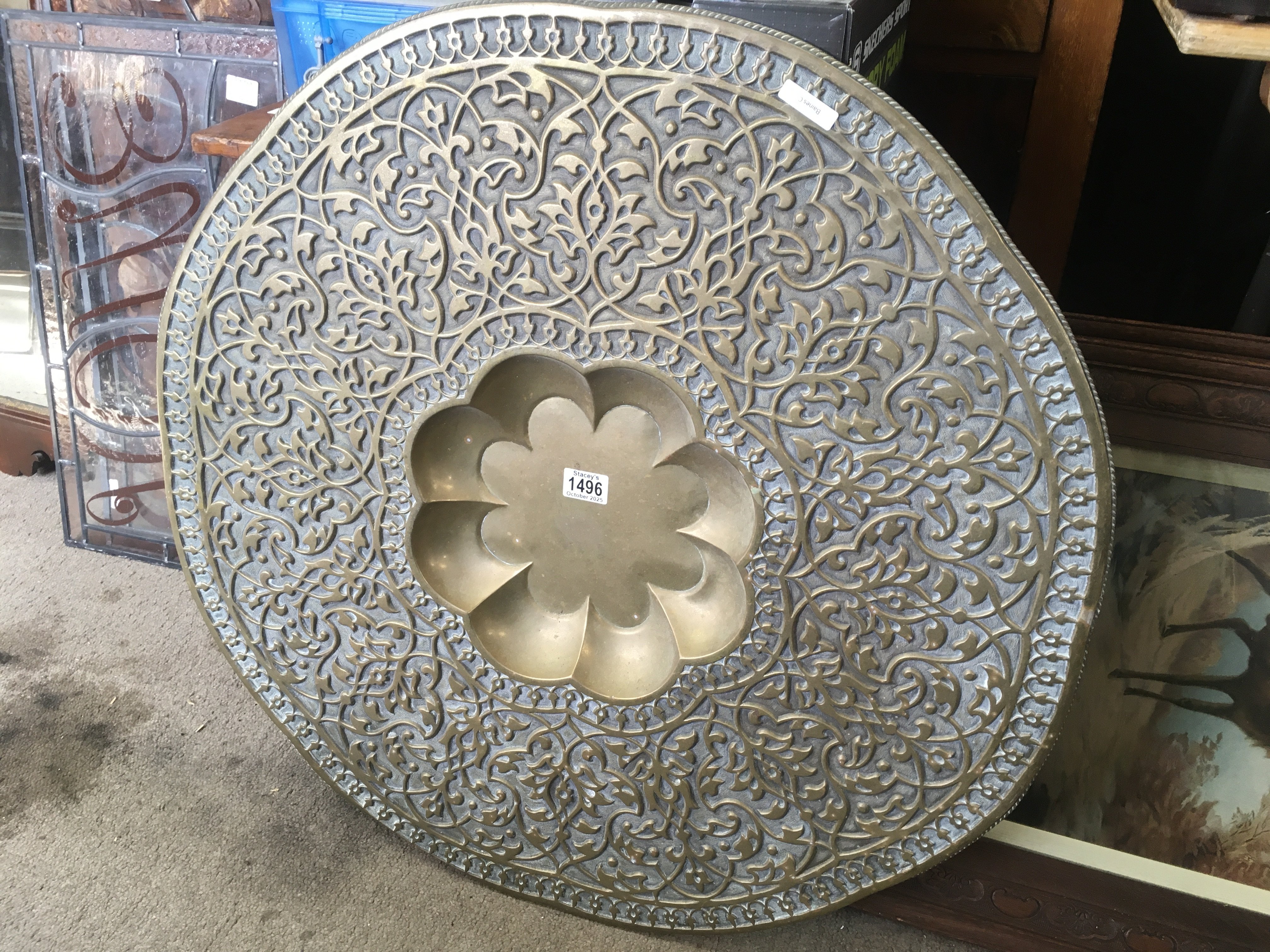 An Indian brass tray. 75cm across