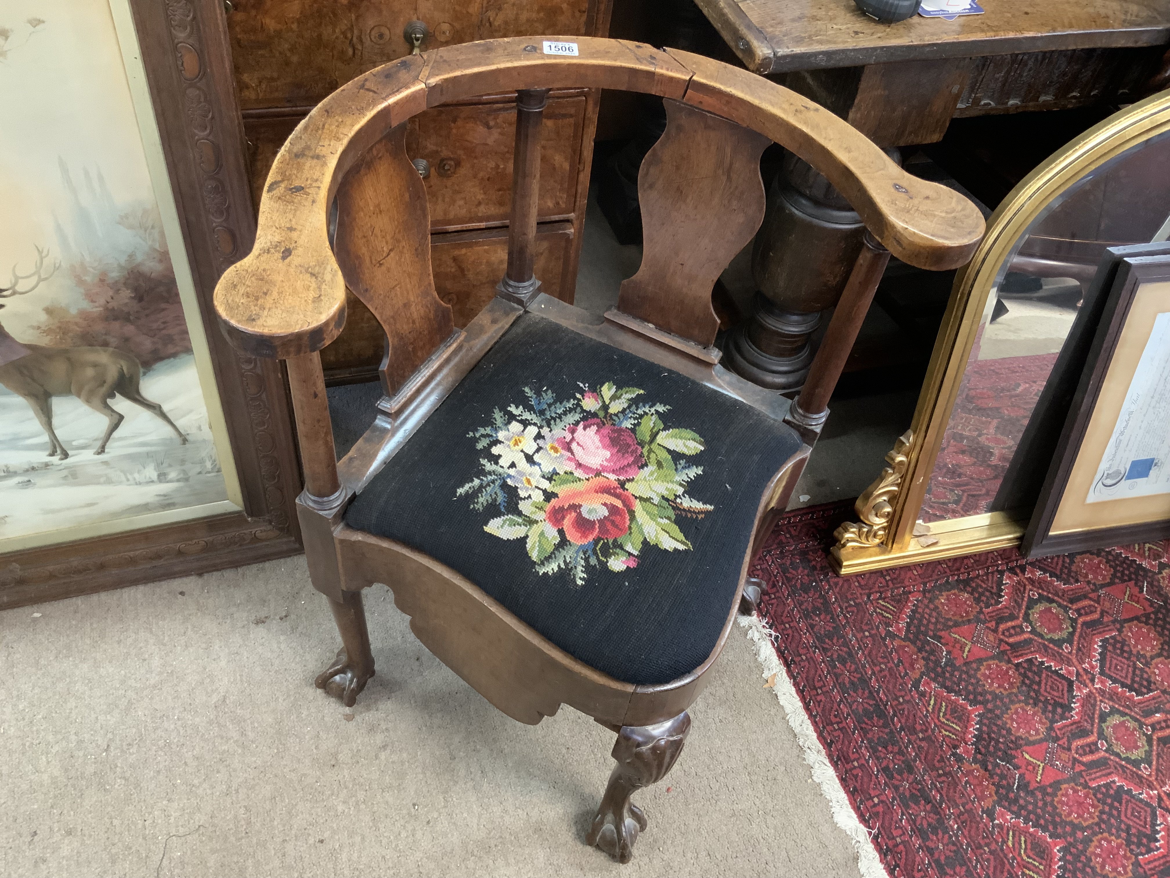 A George III mahogany corner chair, damage to top rail.