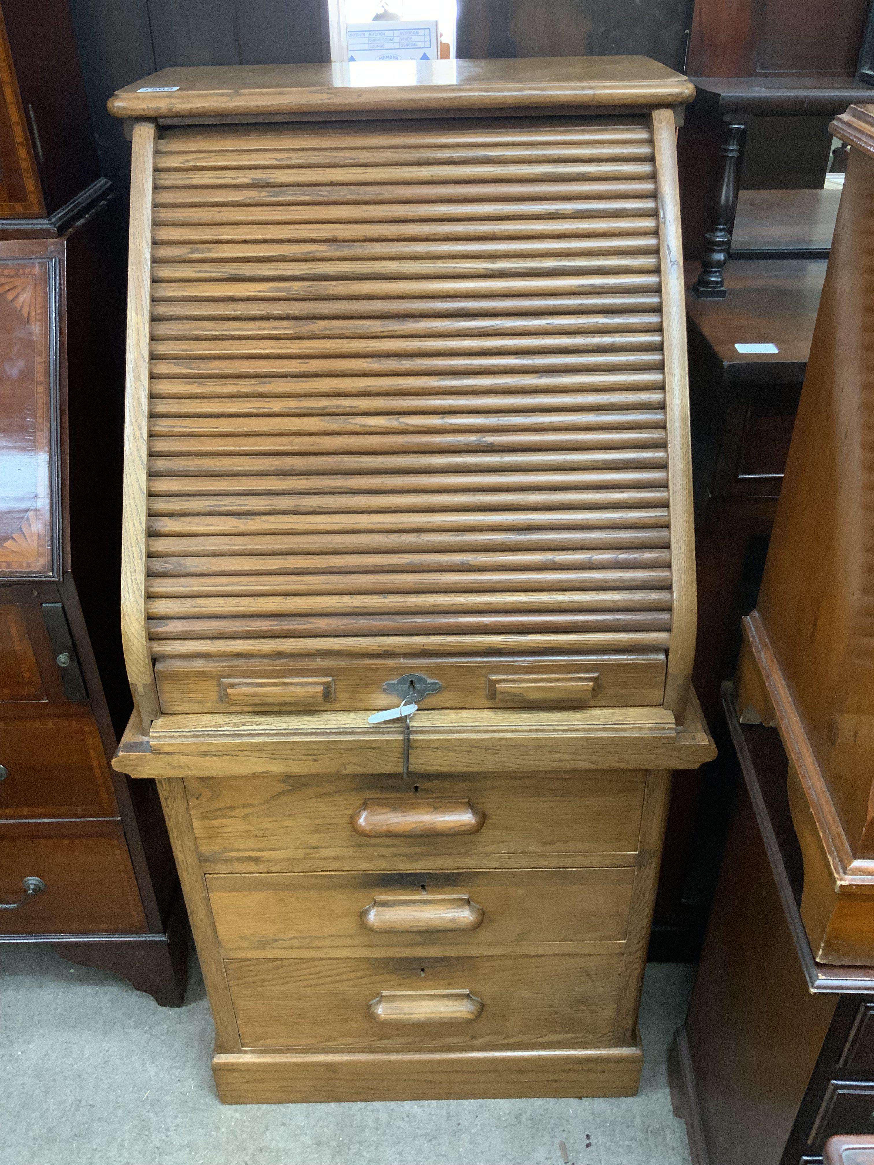 A 1930s Lebus Oak Tambour fronted desk. 117cm x 63cm x 58cm