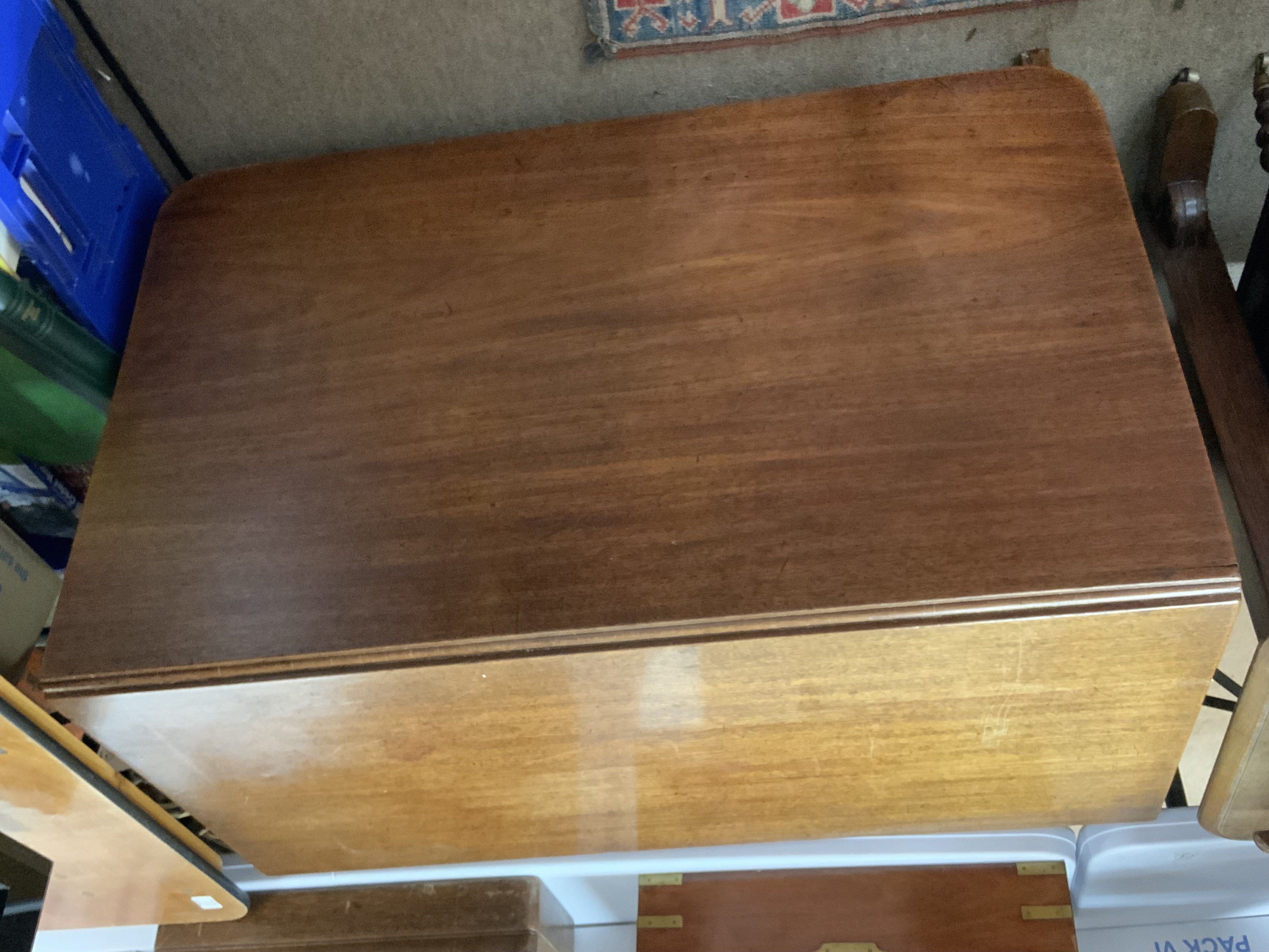 A large Victorian mahogany drop leaf dining table. 107cm x ext 186cm