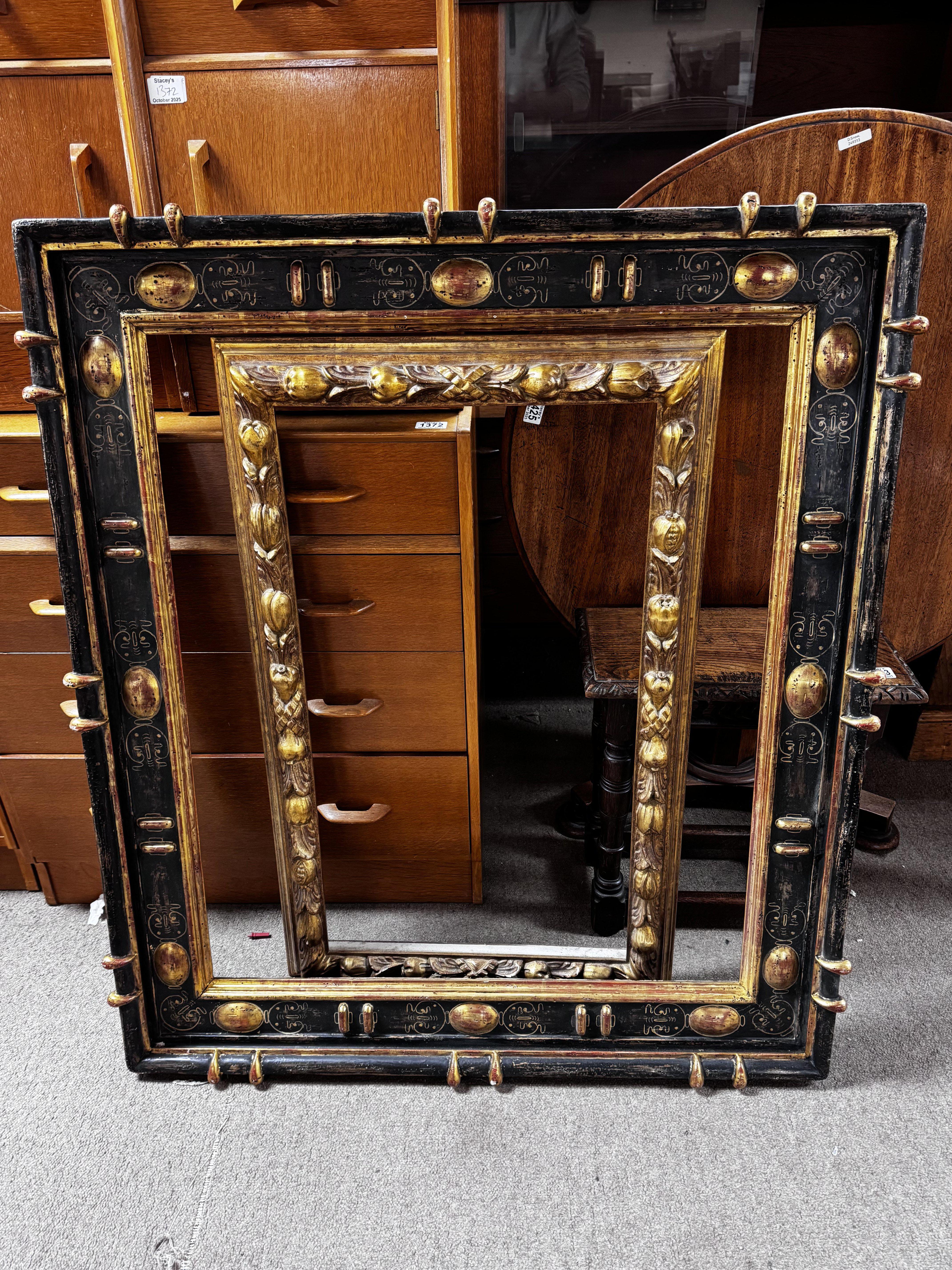 A 19th century Spanish frame with hand painted details 98cm x 111cm together with a gilt framed picture frame. 60cm x 98cm