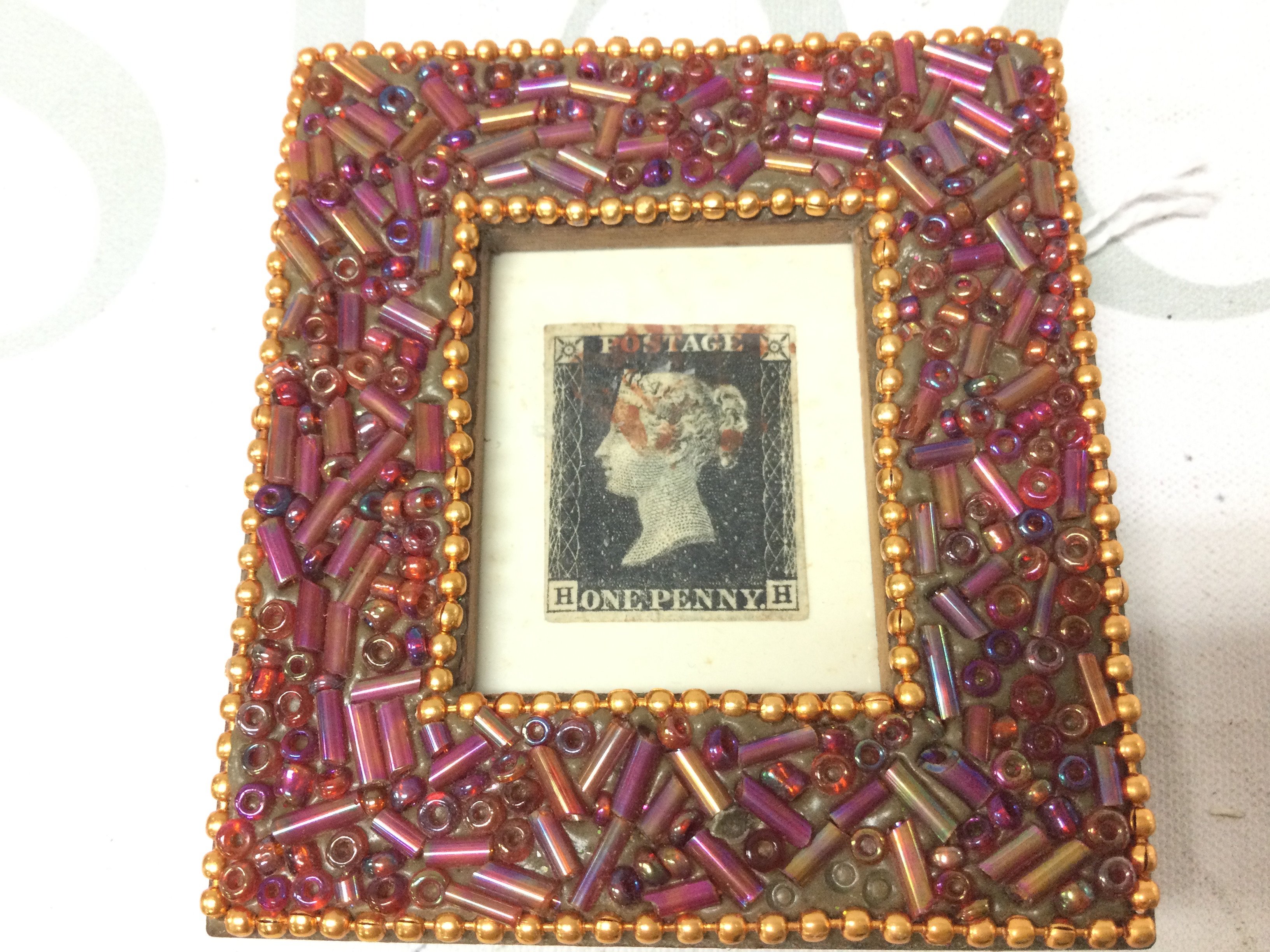 A framed penny black stamp . Postage category a