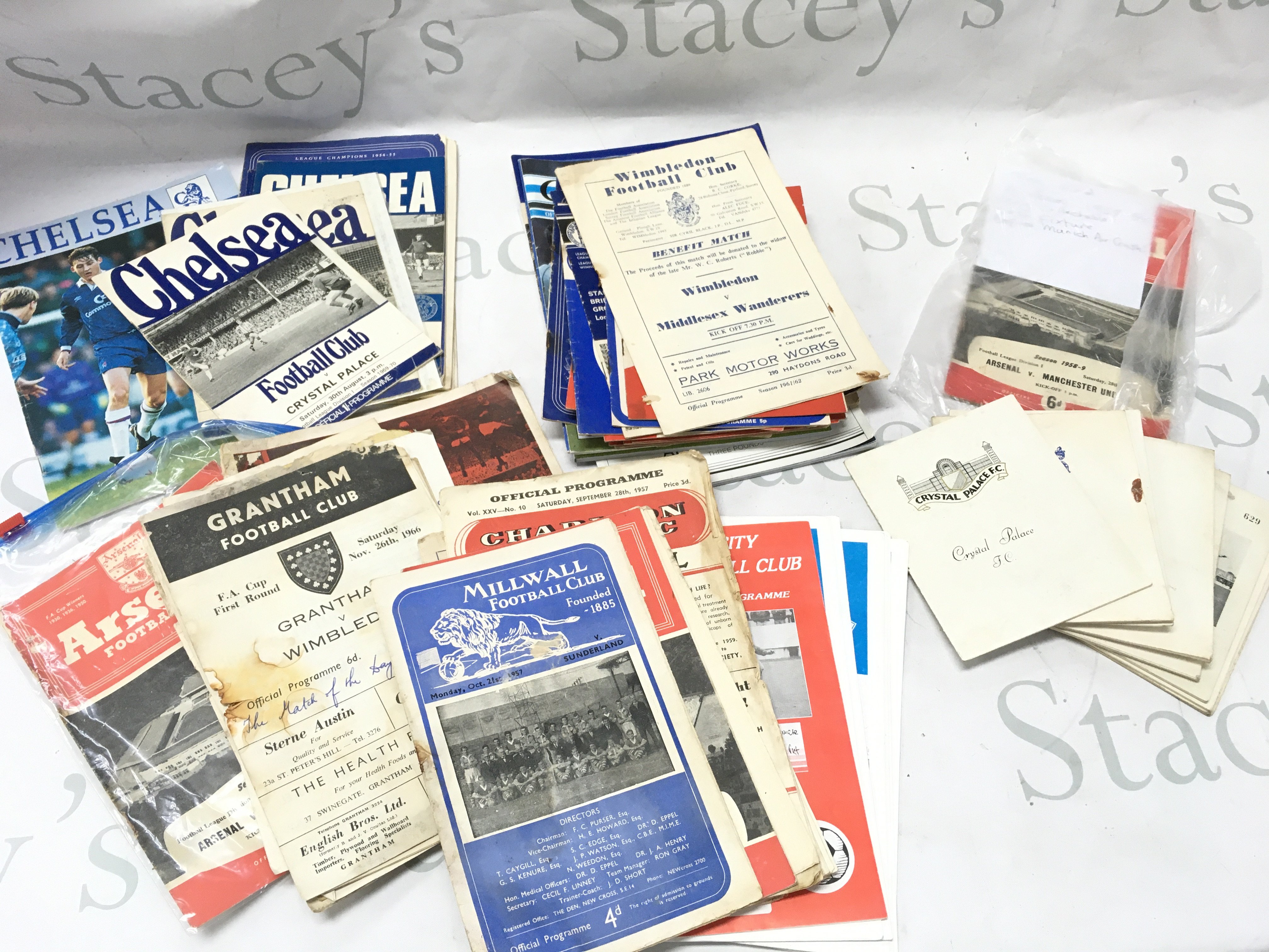 A mixed lot of vintage football programmes , postage category B