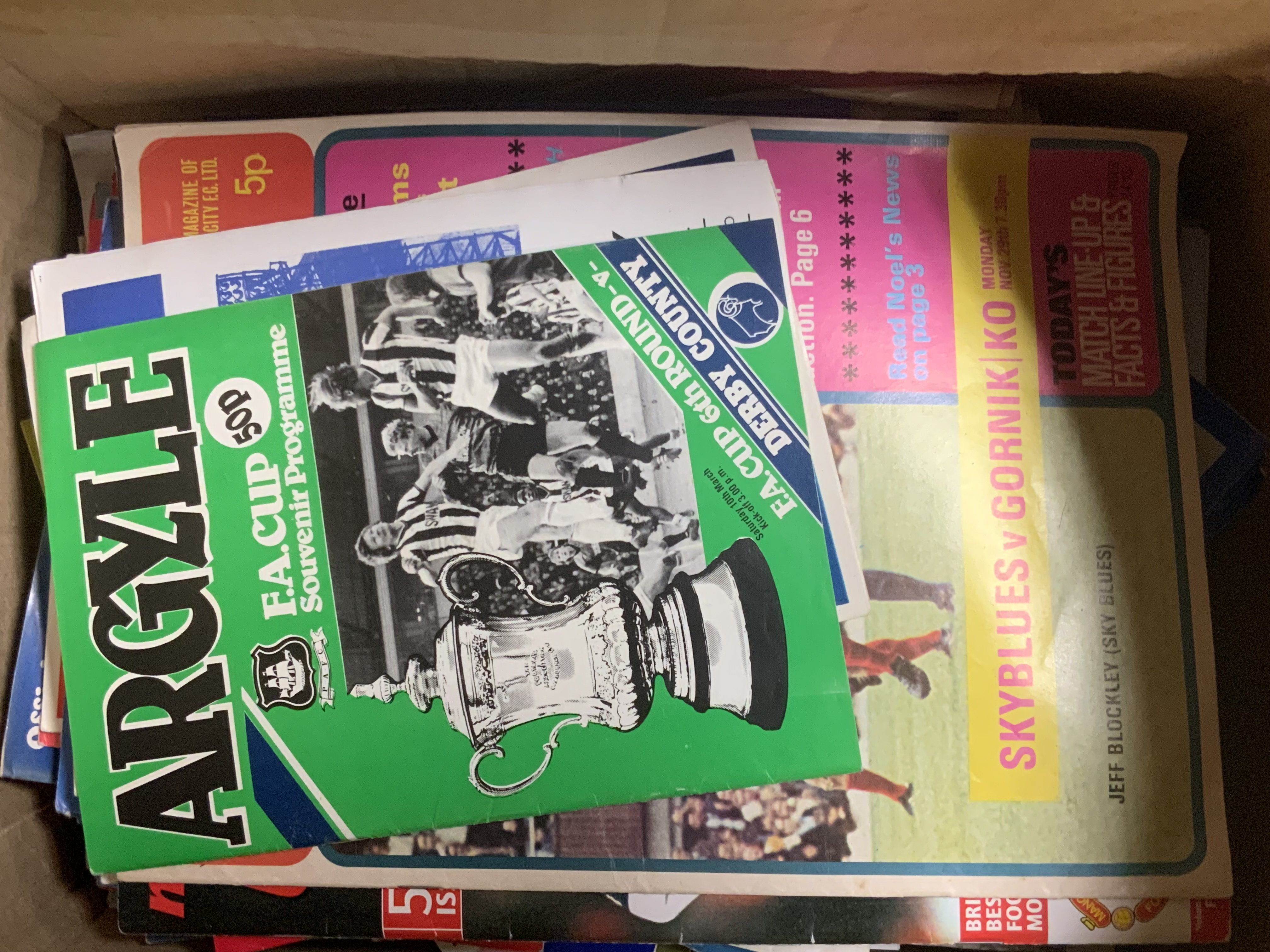 A large box of various football programmes from the 1970s onwards including League, FA cup and Internationals.