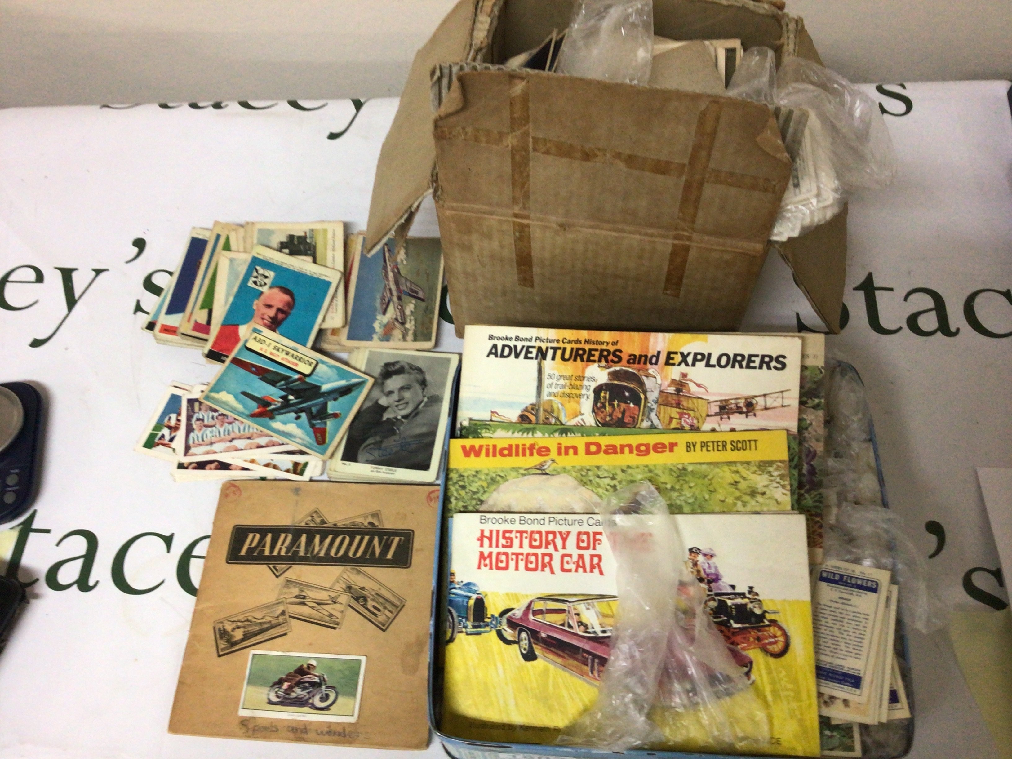 A Collection of Vintage ABC cards including football a collection of cigarette cards and tea cards in a box and tin.