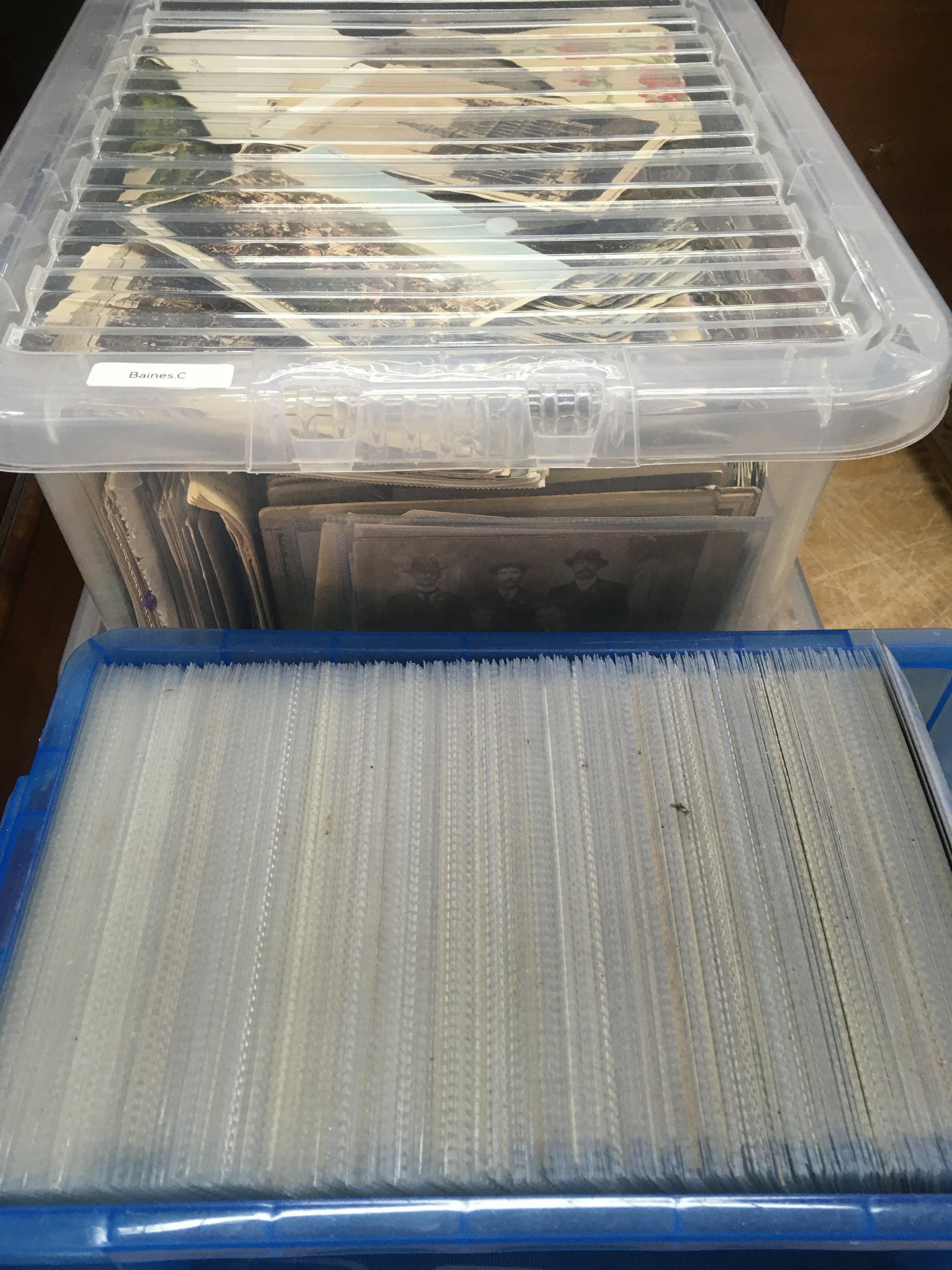 Four boxes of postcards various.