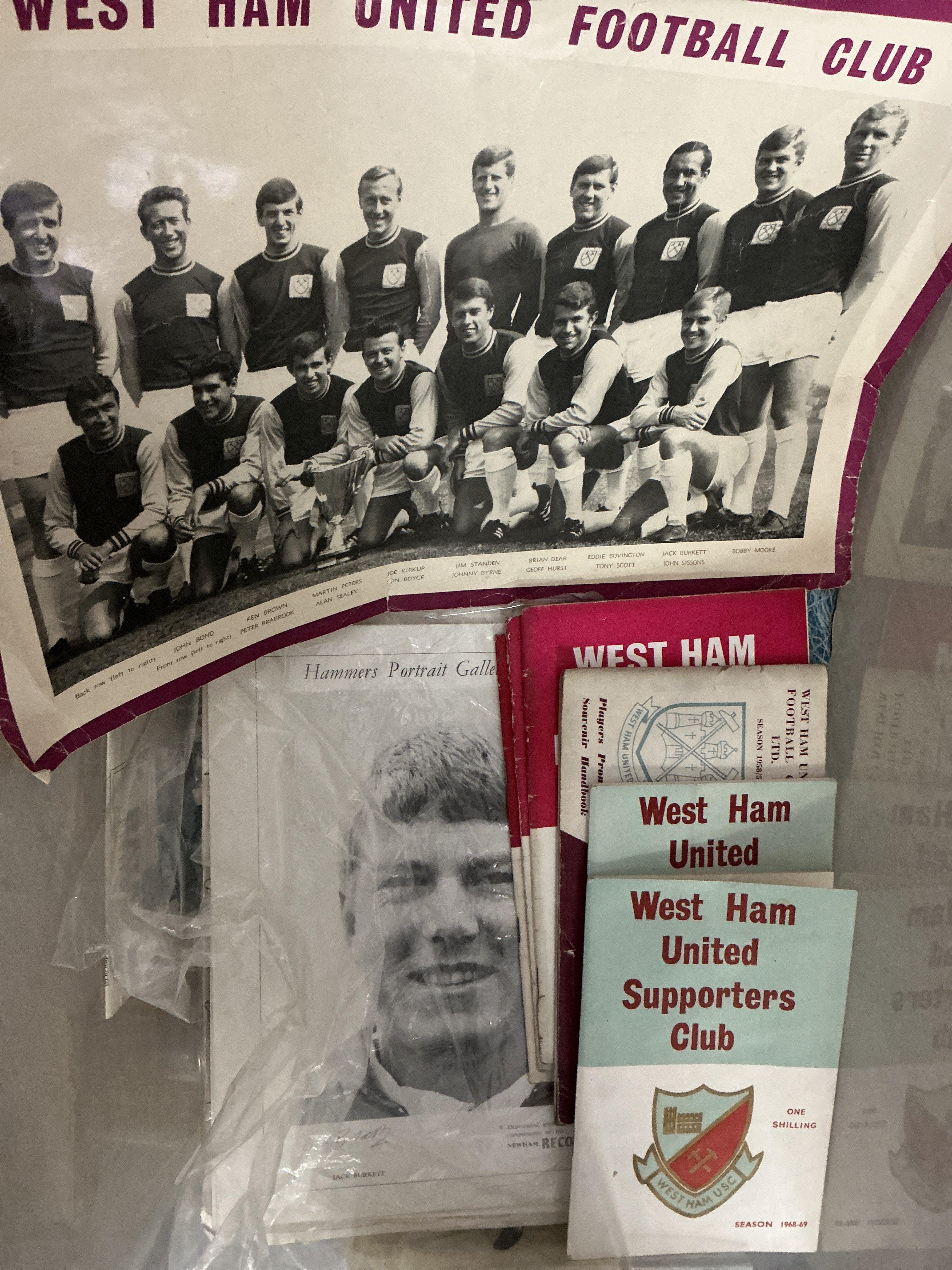 West Ham Football Memorabilia Box: Large box containing photos, handbooks, 2 programme binders, puzzle, signed John Lyall book, menus including 2 signed, scrapbook, cuttings, replica shirt and much more.