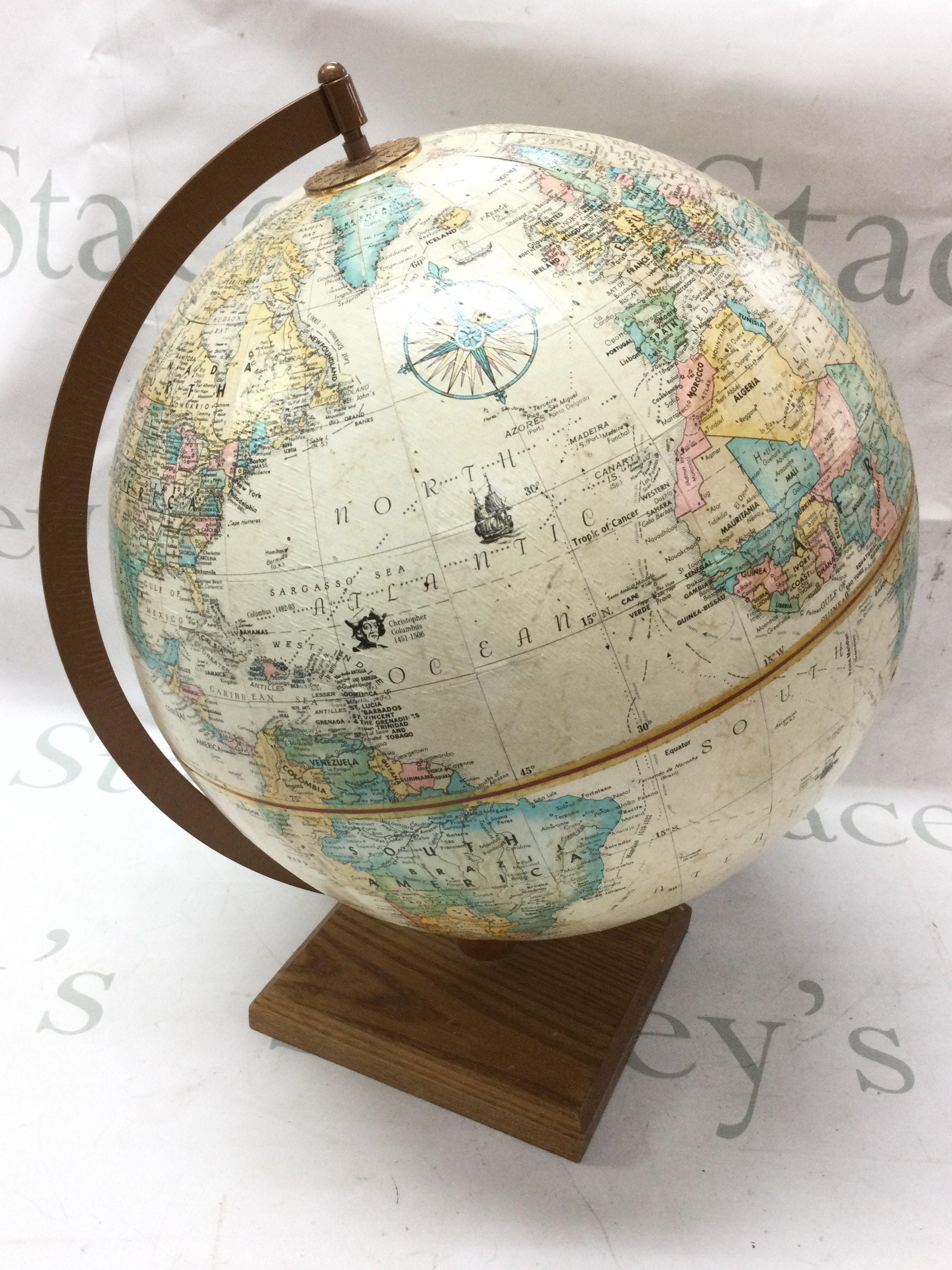 Large American globe of the world with raised mountain areas , 39cm tall. This lot cannot be posted