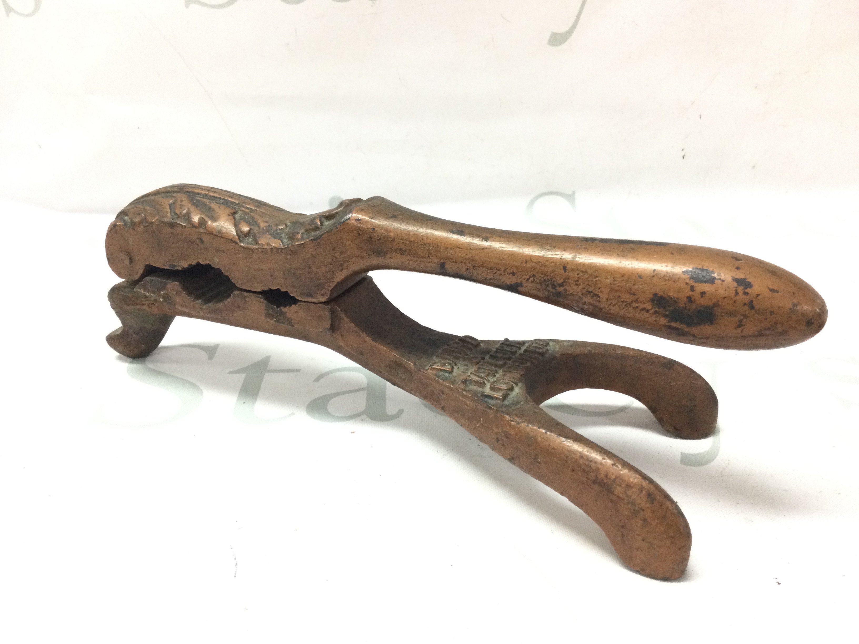 An unusual Victorian heavy metal nut cracker by Bard and Tatlock London, 24cm long. Postage category B