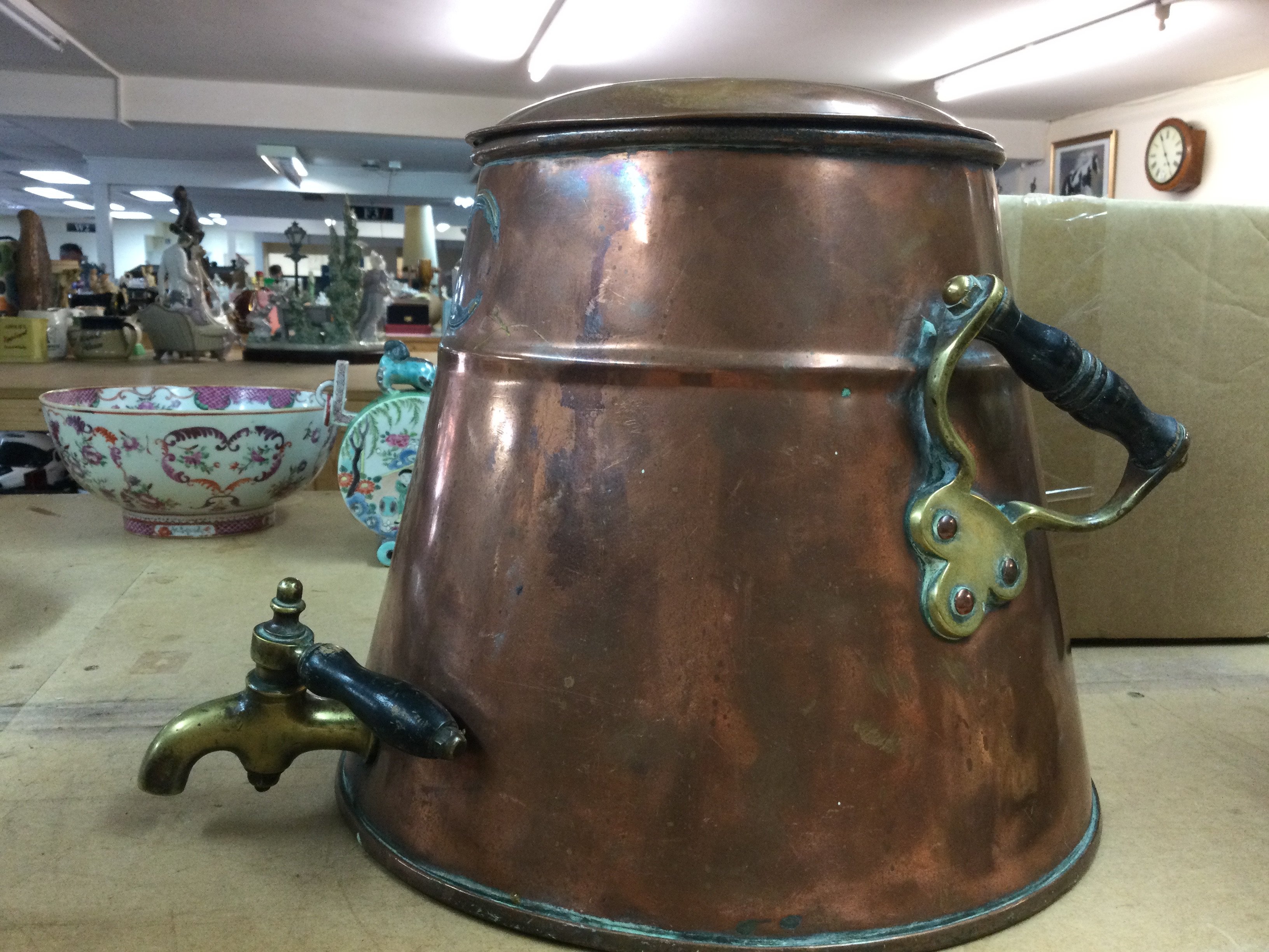 A large heavy two handled vessel with tap . This lot cannot be posted