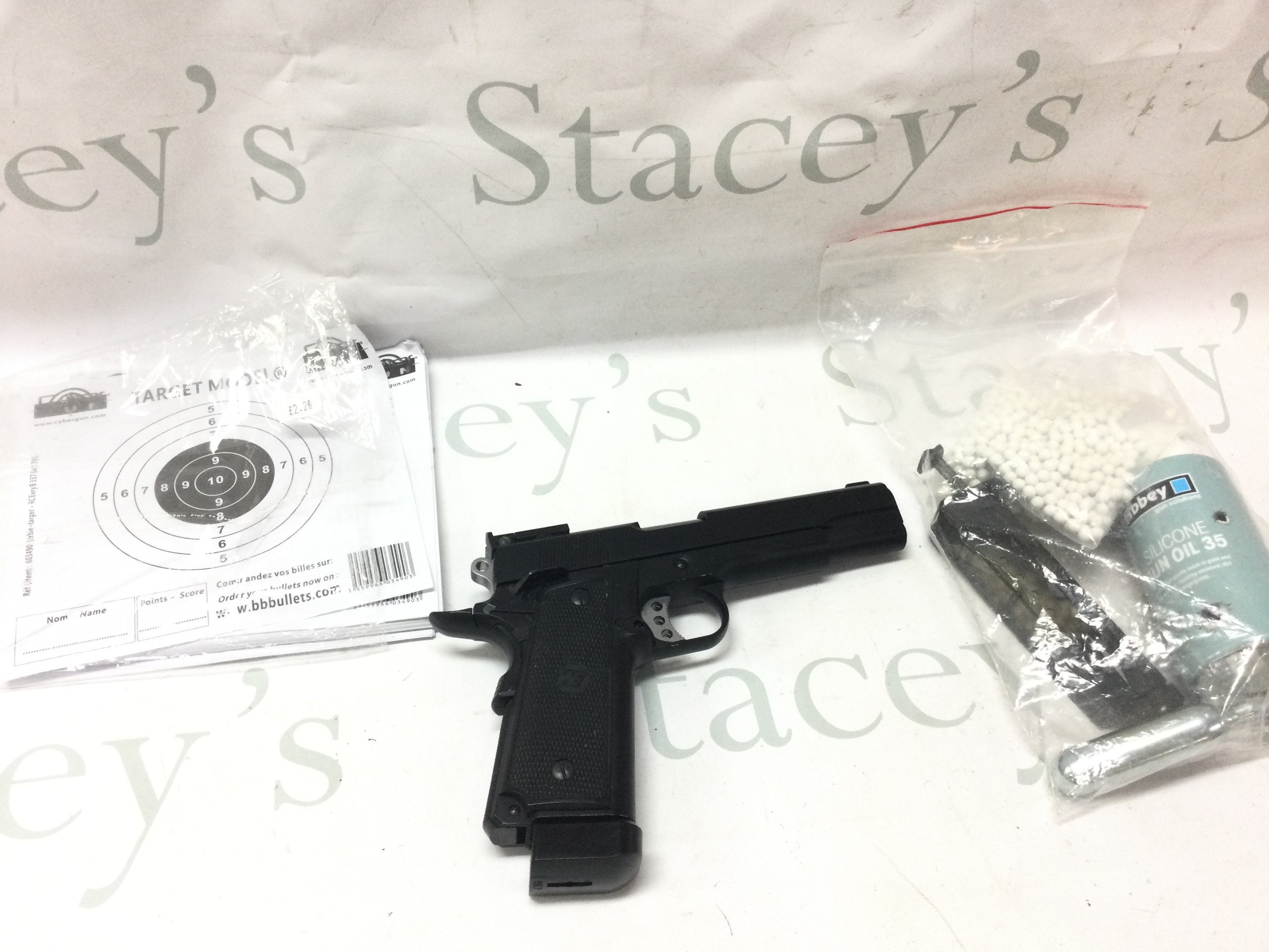 A WE 1911 Airsoft pistol with BBs, Loader, gun oil etc . Postage category B