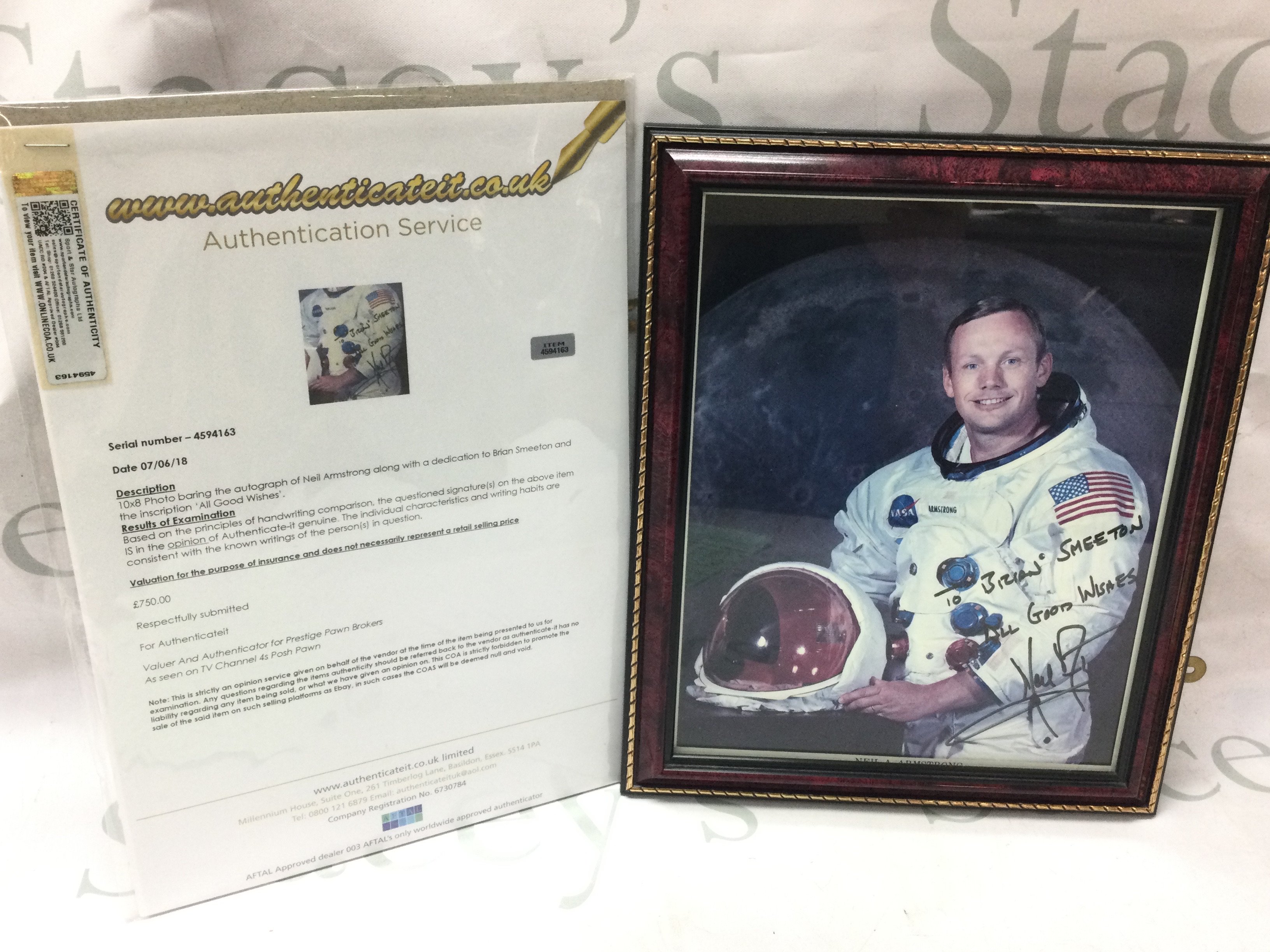 A signed photograph of Neil Armstrong with Certificate of authenticity . Postage category C