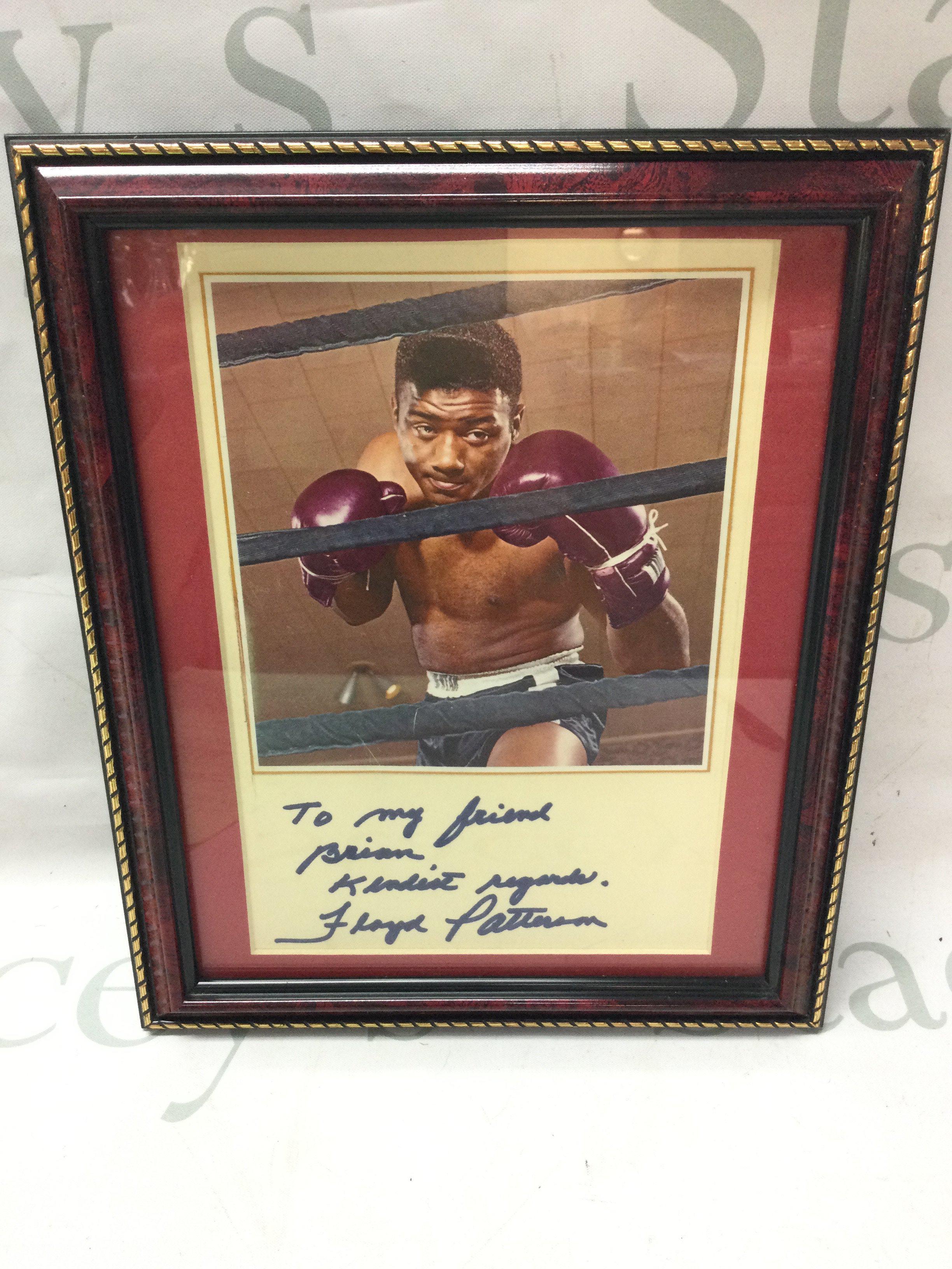 A Floyd Patterson signed autograph , frame dimensions 24x29cm .