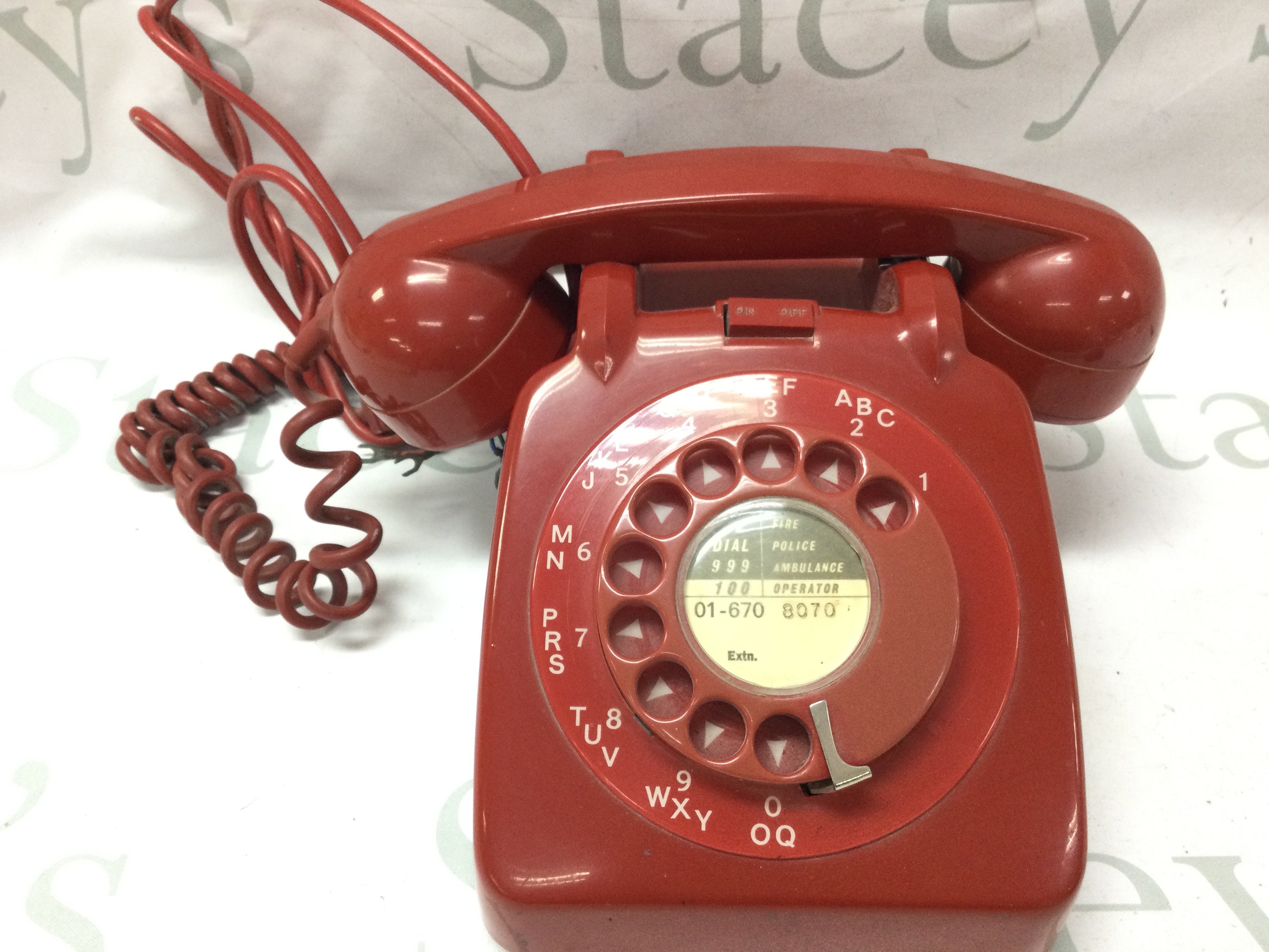 A vintage red telephone . Postage category C
