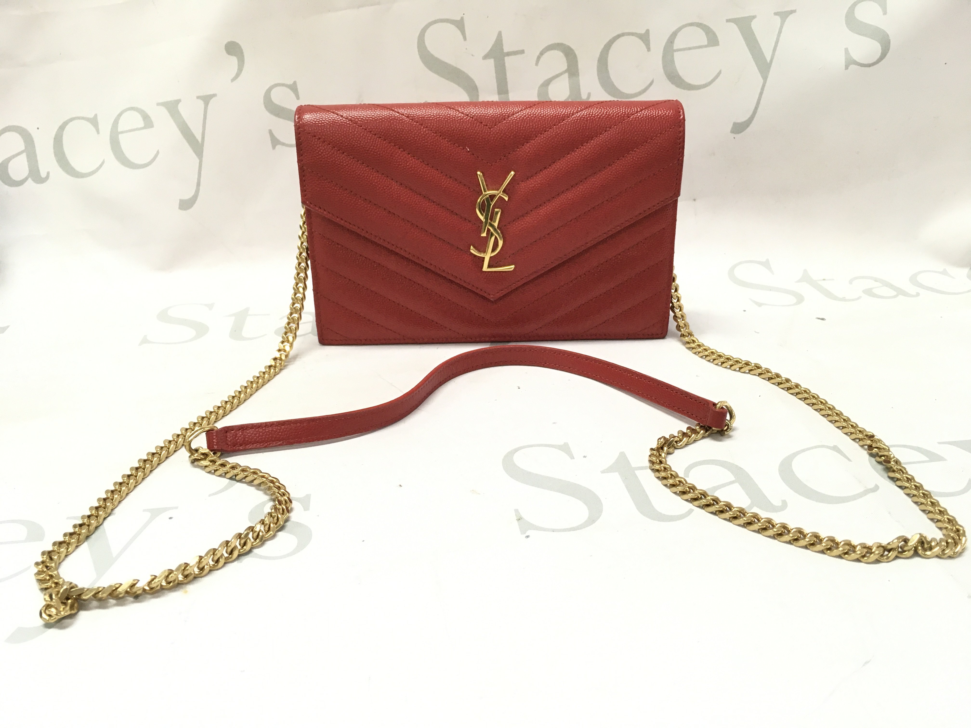 A boxed Saint Laurent Red Grain De Powder Matelasse wallet on chain bag with certificate, receipt and dust bag