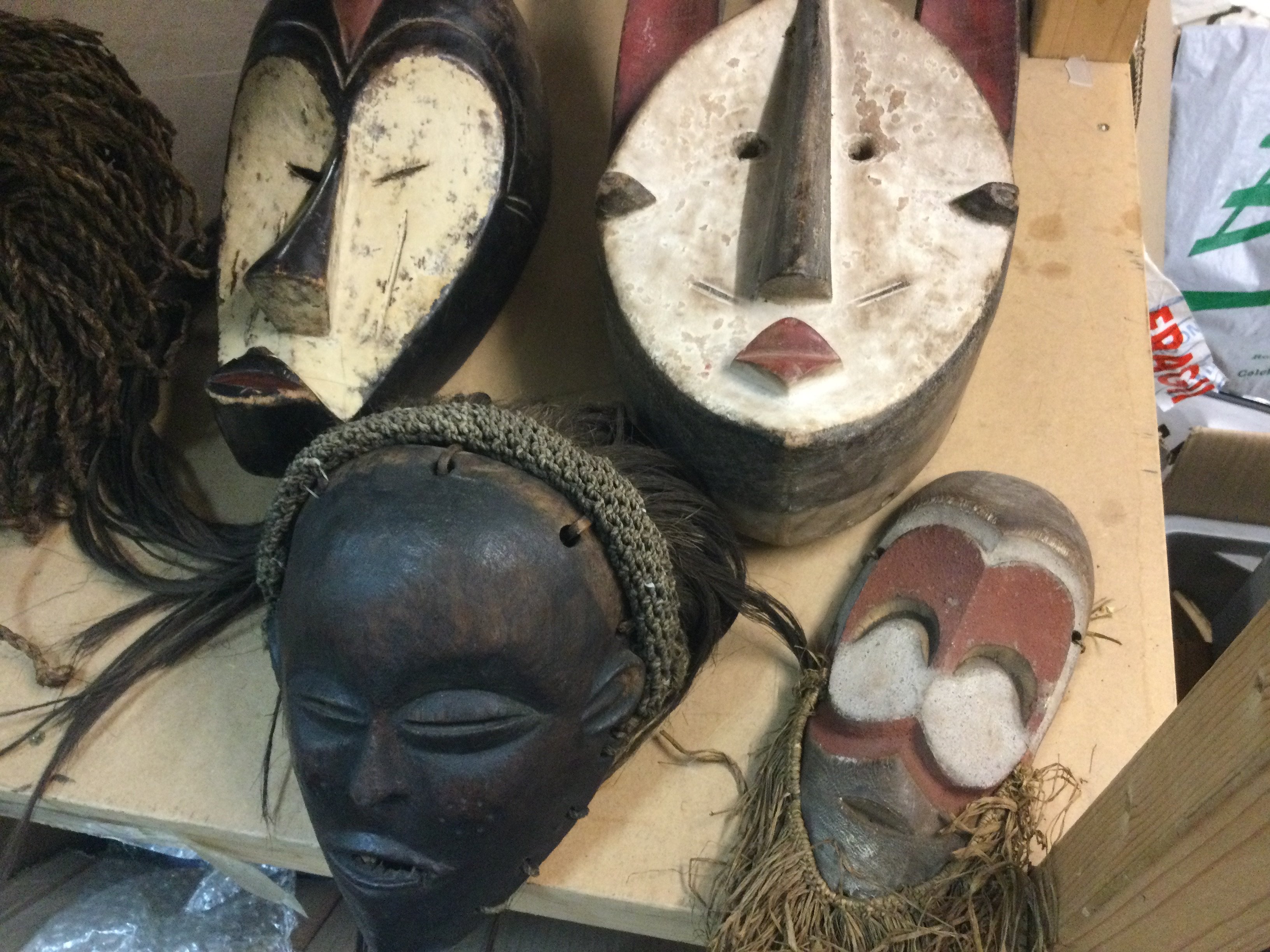 A collection of six African tribal masks including ceremonial and chokwe .