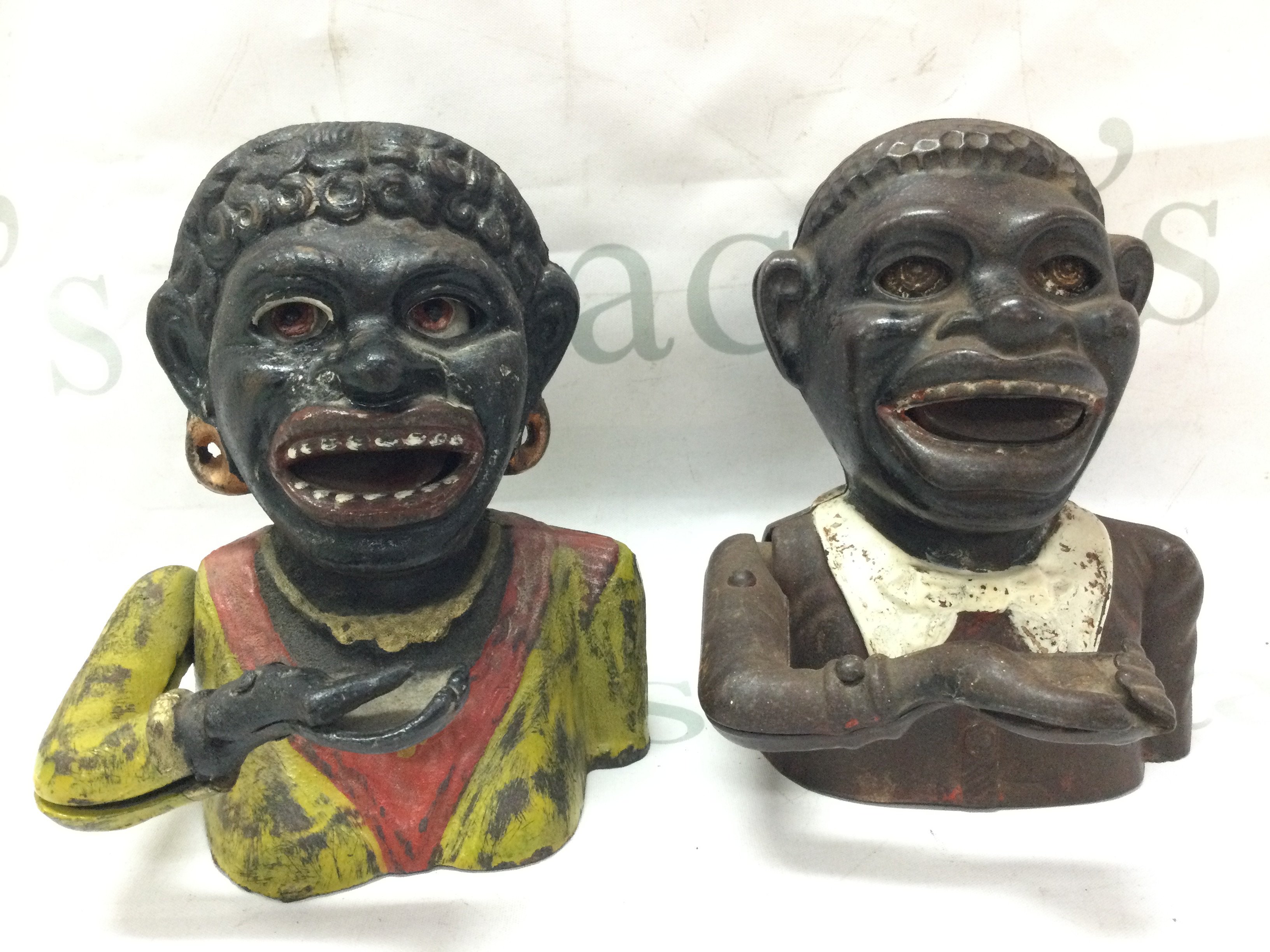 Two vintage cast iron money boxes . Postage category C