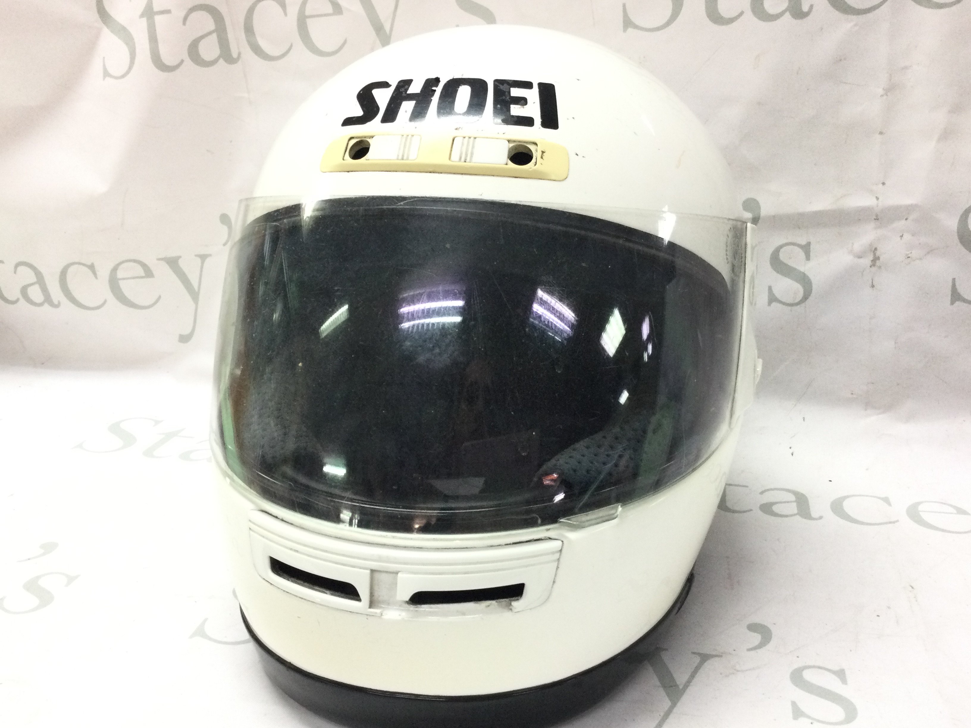 A Shoei motorcycle helmet. This lot cannot be posted