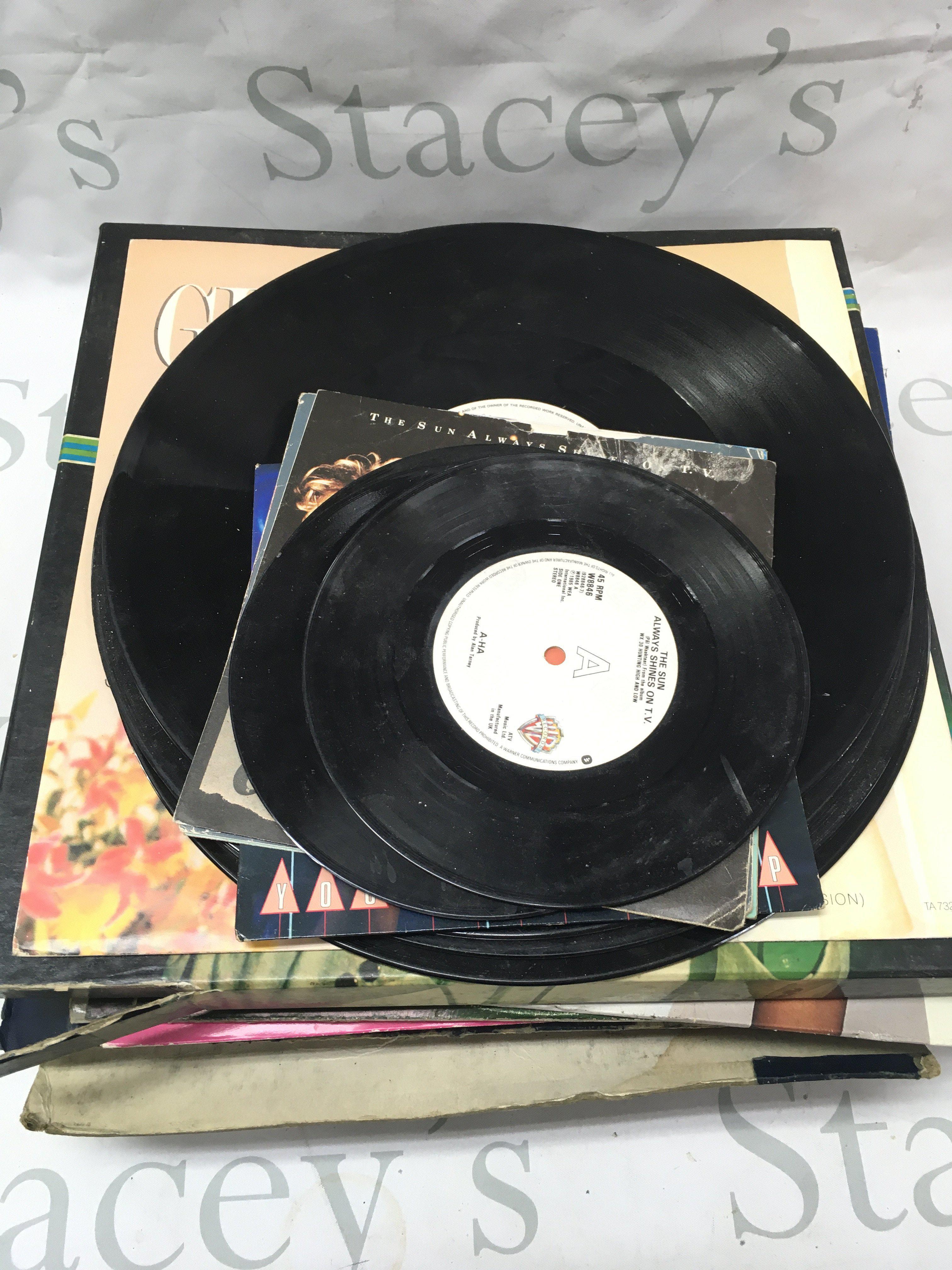 A small collection of LPs including A-Ha, Whitney Houston, wham, Micheal Jackson etc.