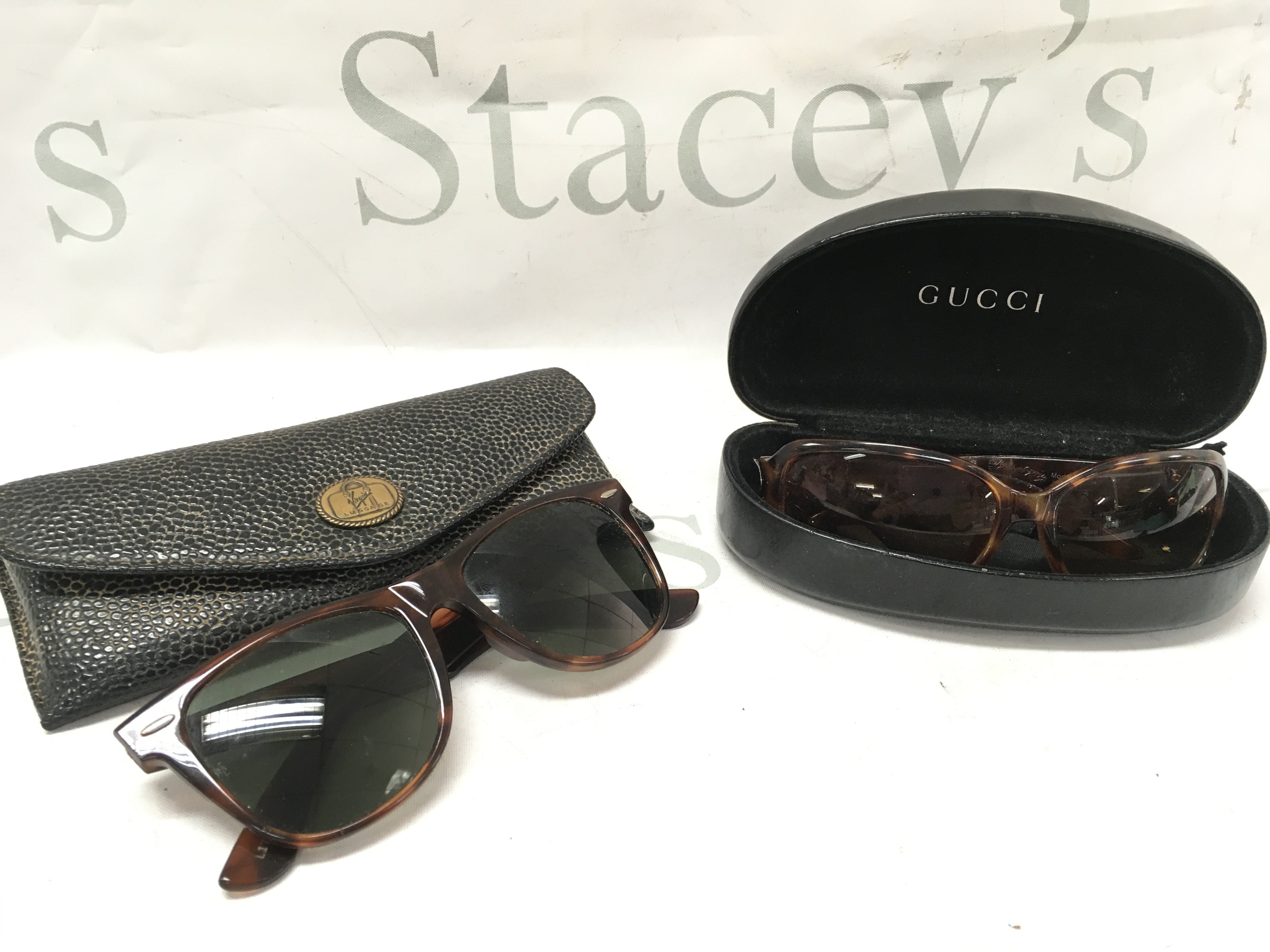 Ray Ban USA sunglasses Wayfarer II and Gucci mod 1019 002 sunglasses . Postage category B