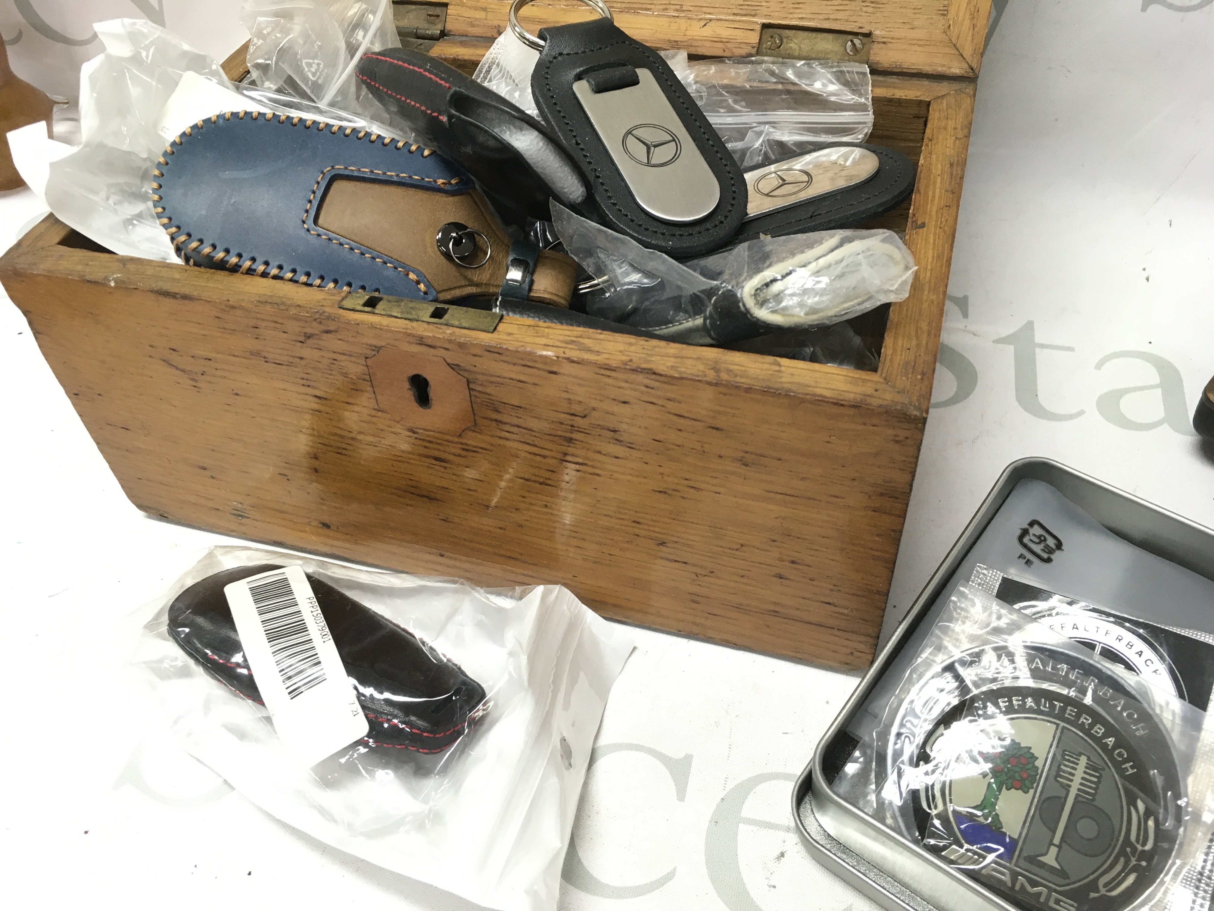 A collection of car key pouches including Mercedes AMG. No reserve Postage category B