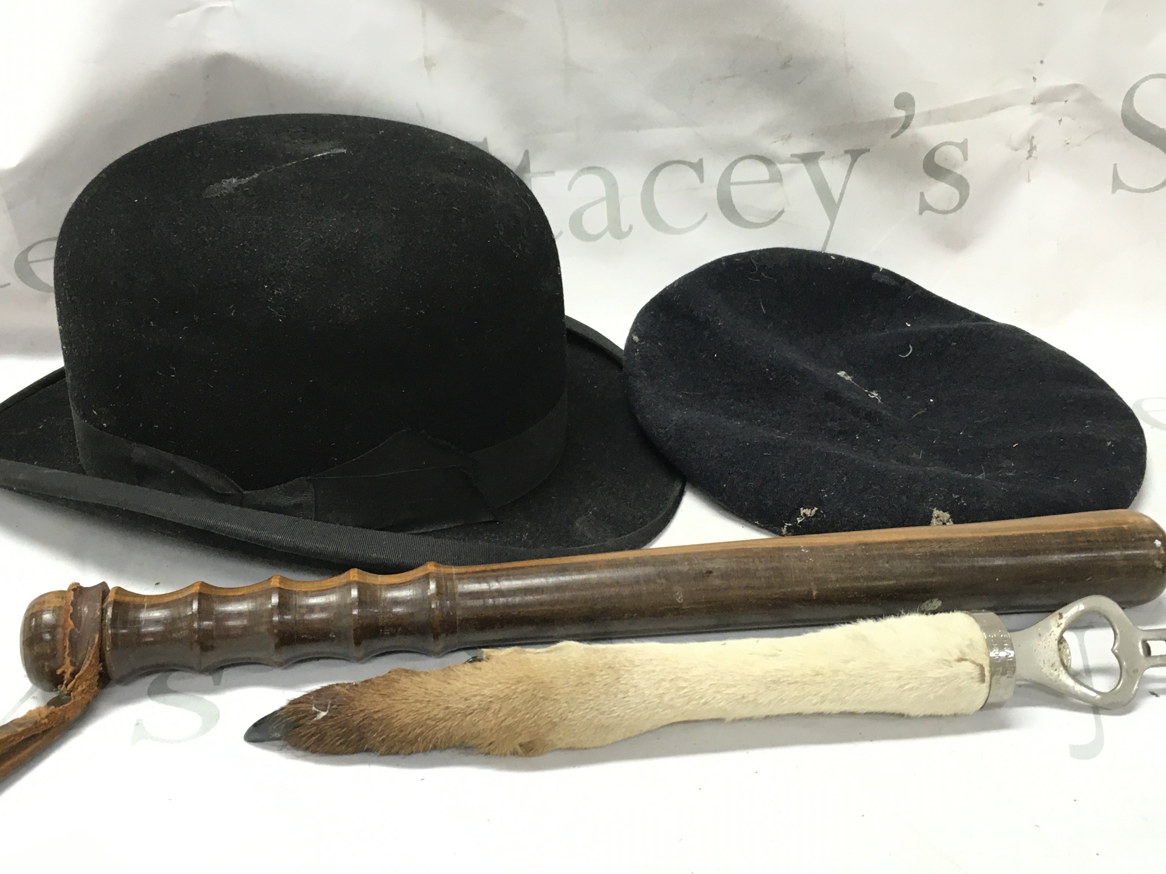 An Australian kangaroo paw bottle opener, baton, Dunn & Co bowler hat , royal army hat. Postage catC