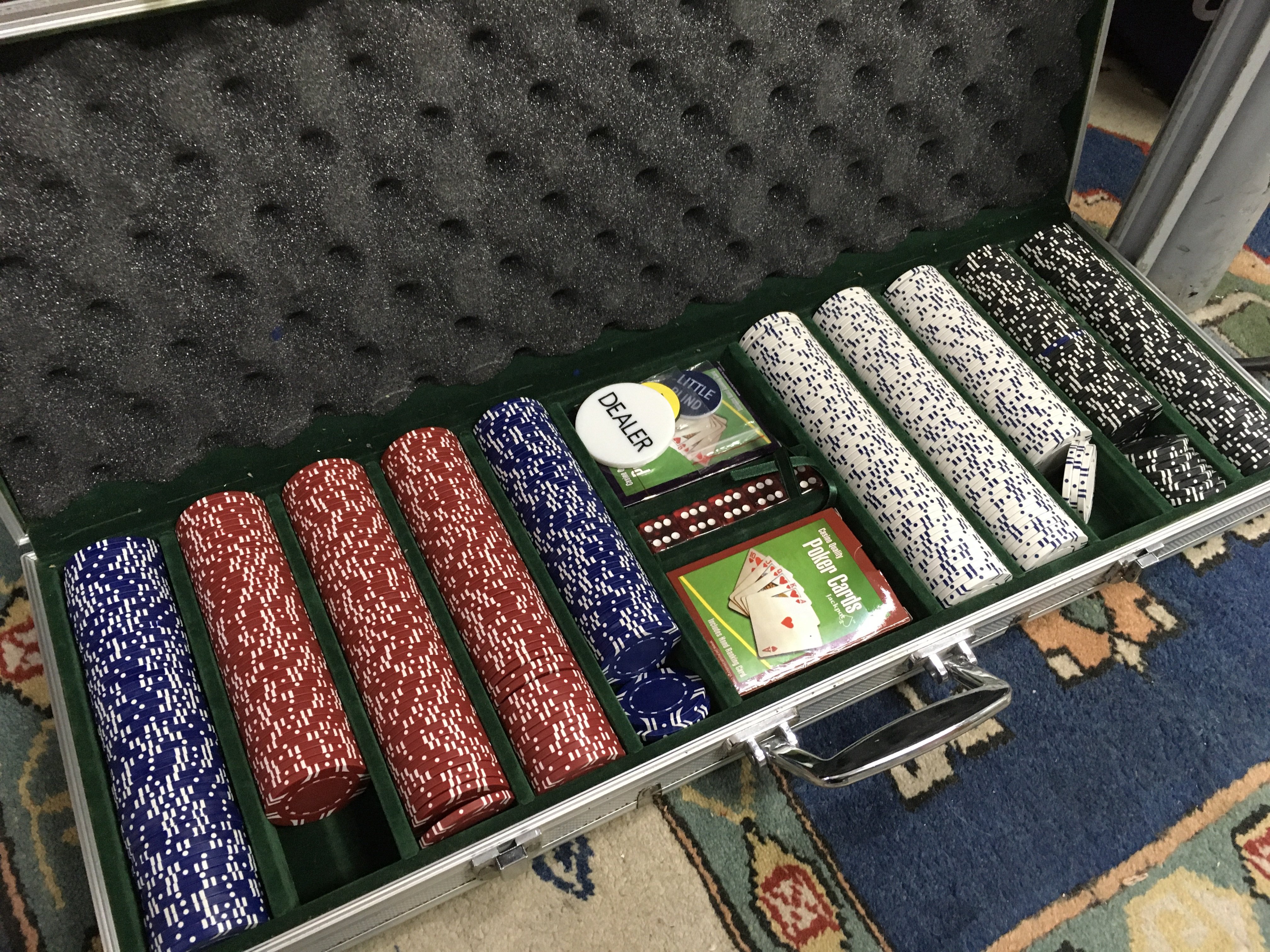 A poker set including chips, fold up table . This lot cannot be posted