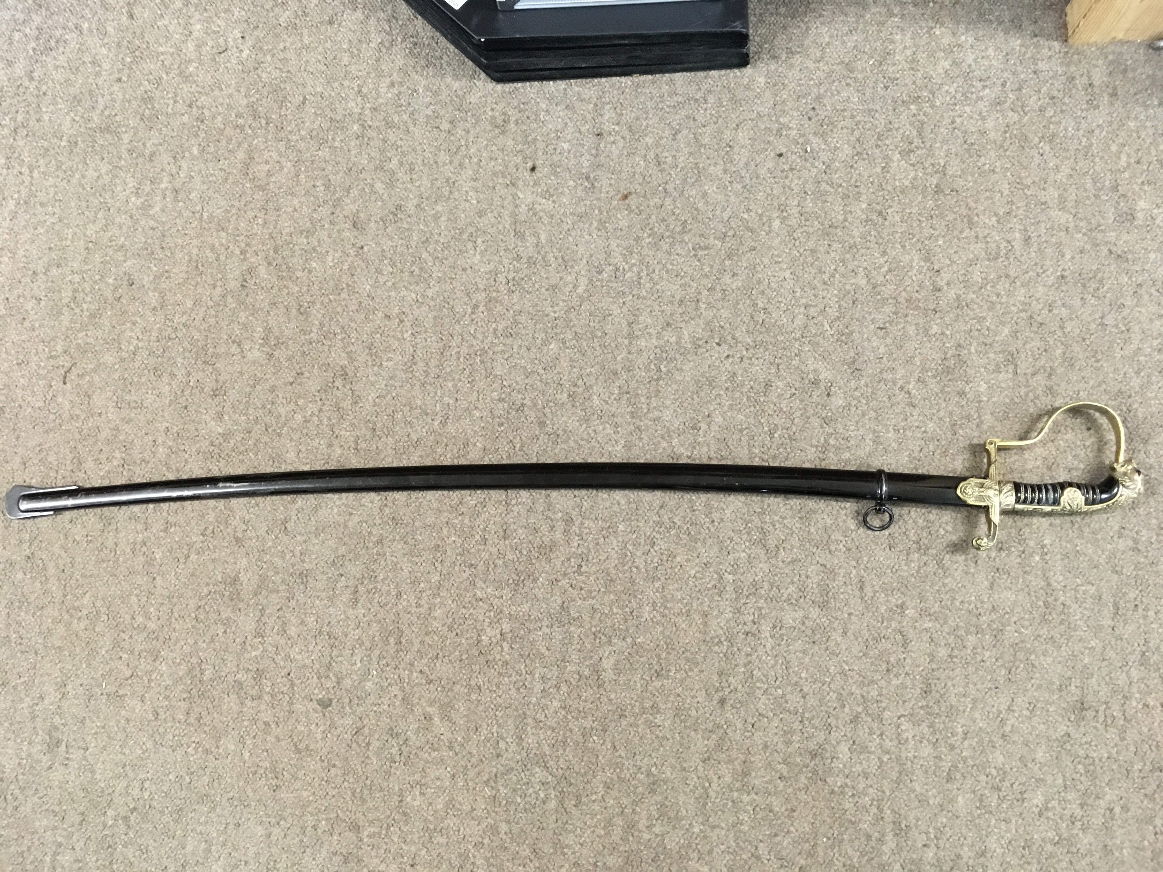 A WW2 German Third Reich SS officers army pattern sword blade unmarked leopards head with red eyes, attributed to Emil Voos , swords of Germany 1900-1945 by Angolia. Blade 87cm long, total sword length 100cm