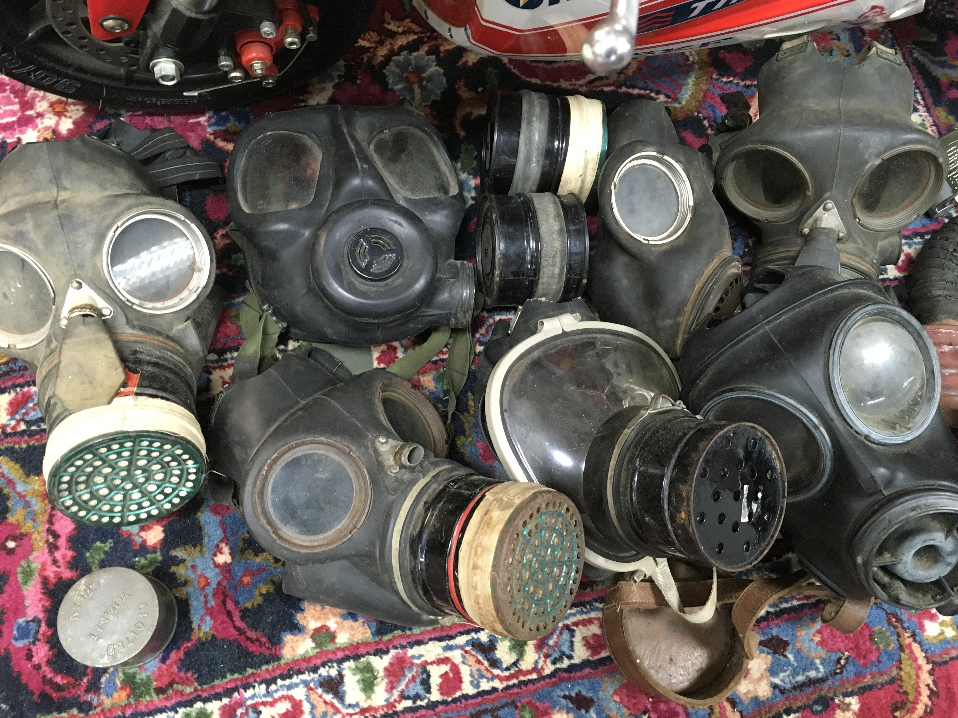 A collection of gas masks . This lot cannot be posted