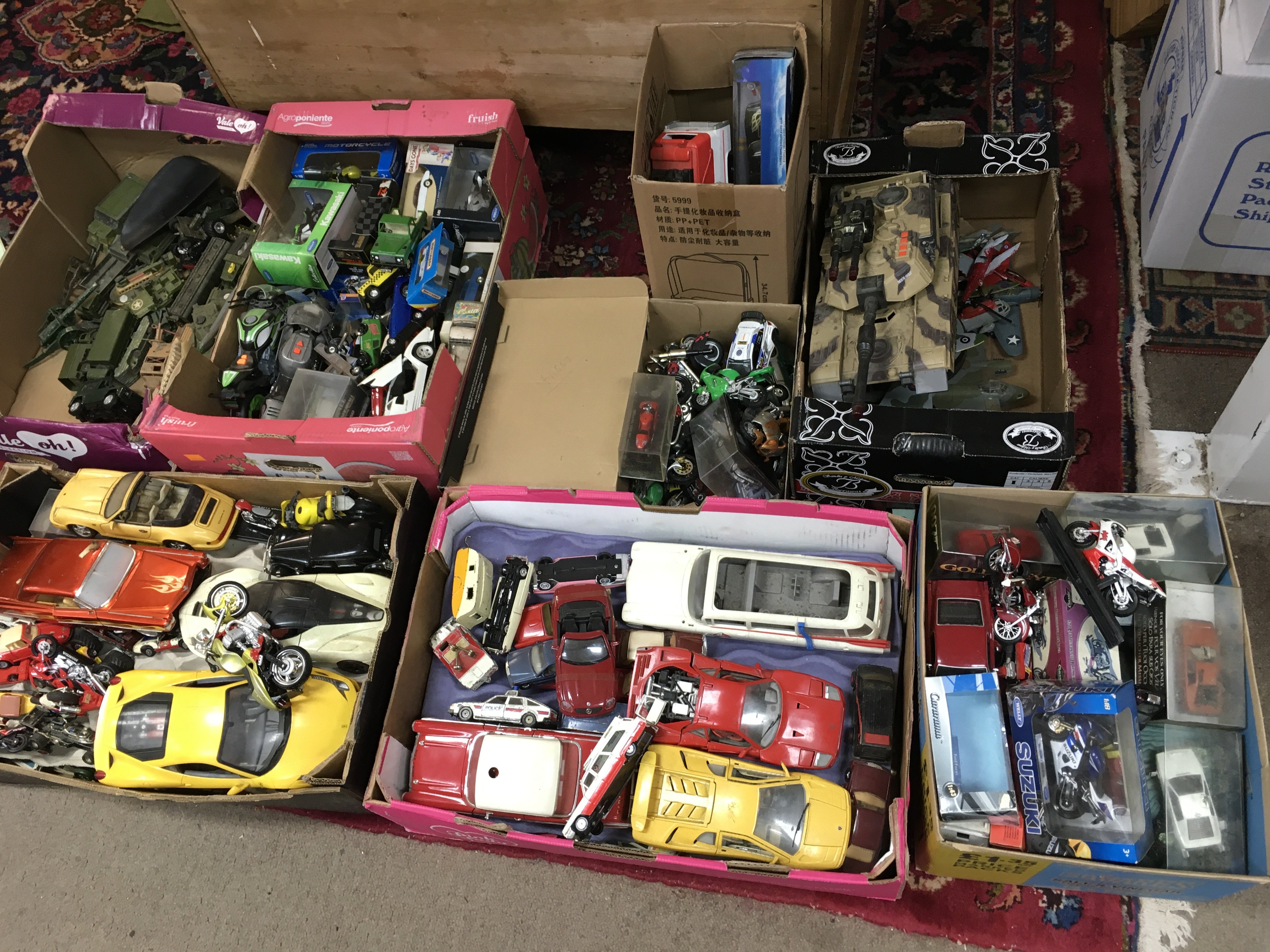 A large collection of toy cars ,bikes ,Dinky army vehicles , large hulk hogan figure etc. this lot cannot be posted