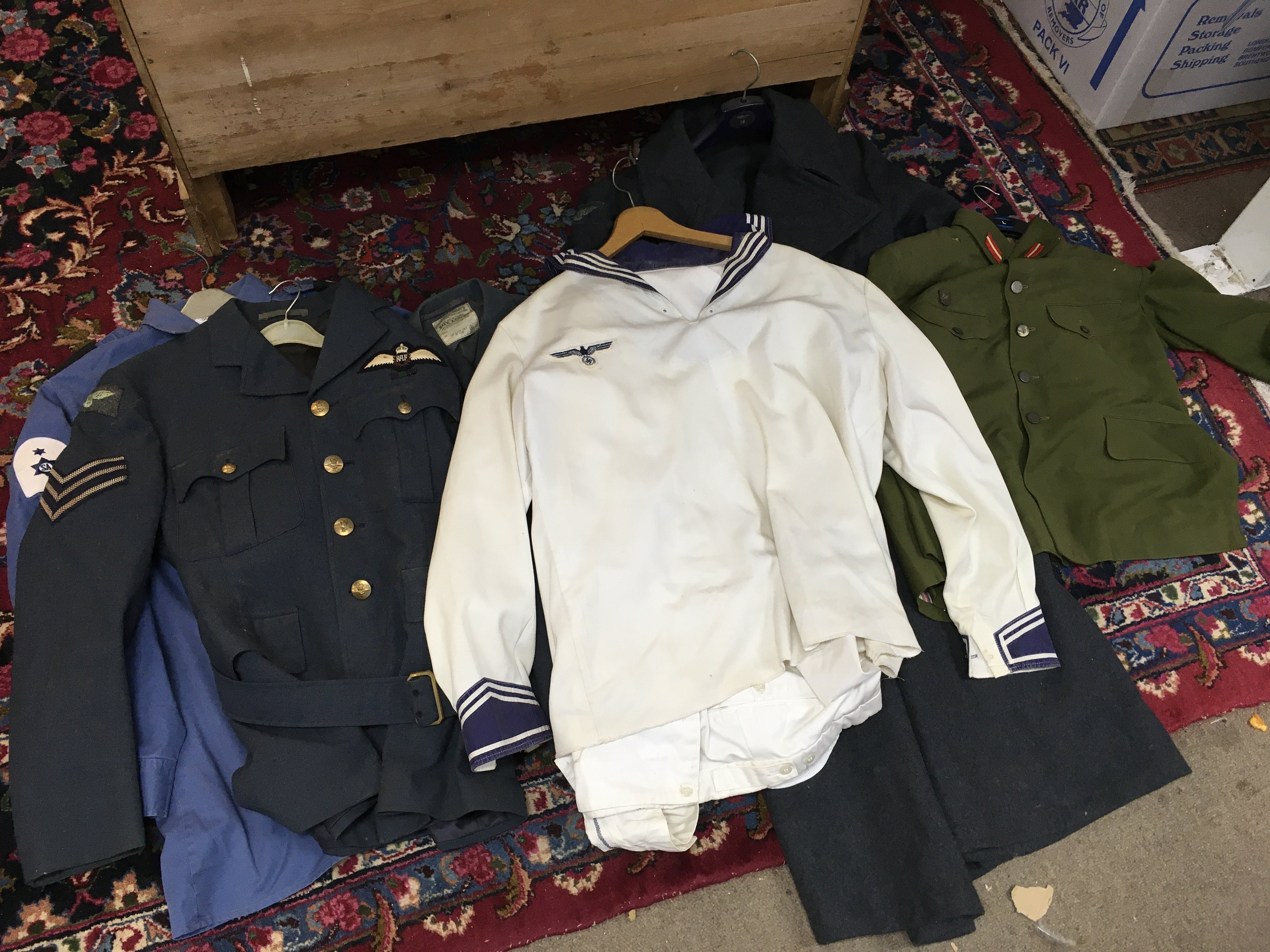 A collection of retrospective military uniforms including RAF jacket,  Kriegsmarine jacket ,RAF Long coat, Royal Marines commando camo jacket etc