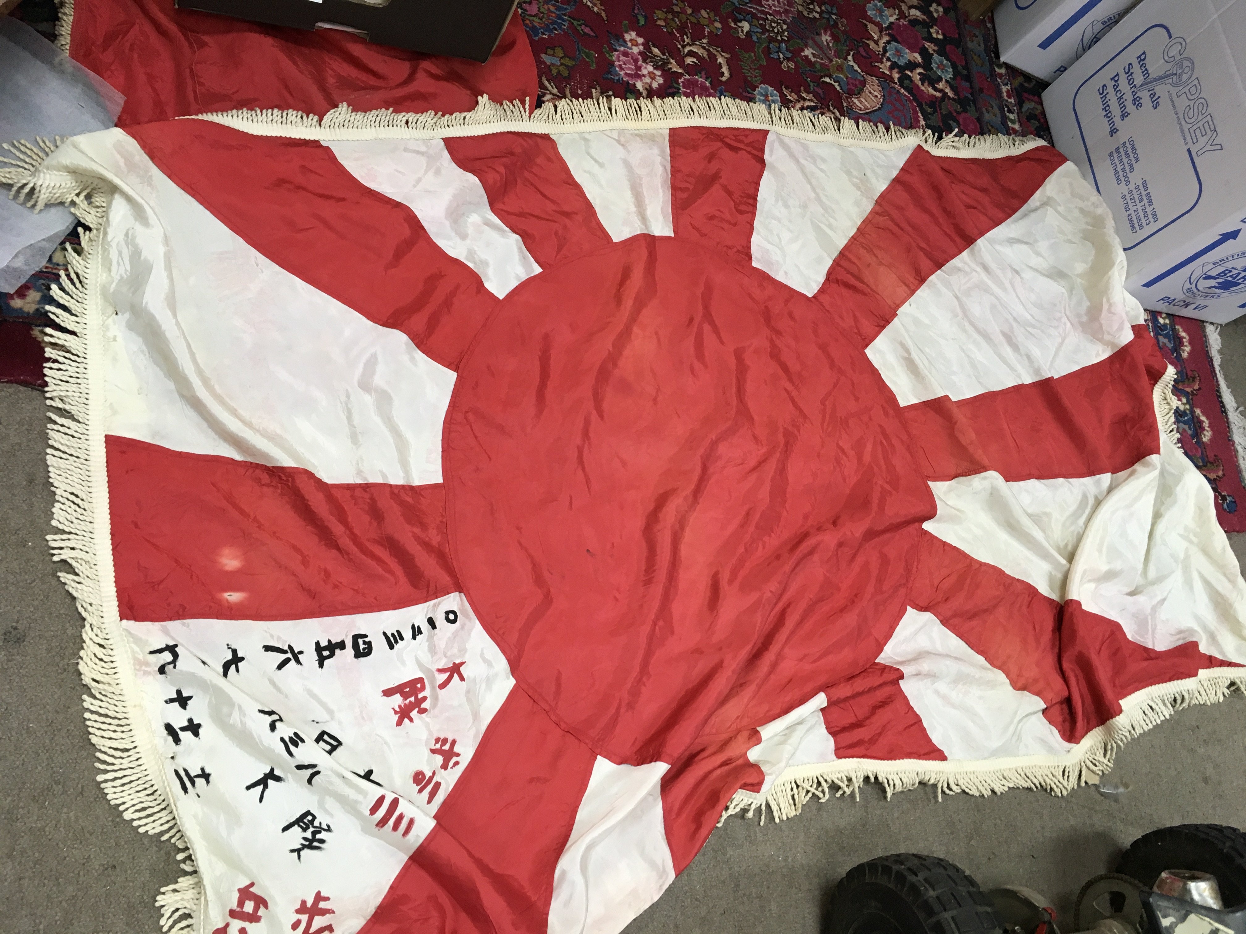 A collection of flags including Japanese rising sun, Bob Marley flag, Third Reich flags and five reproduction aircraft posters. No reserve