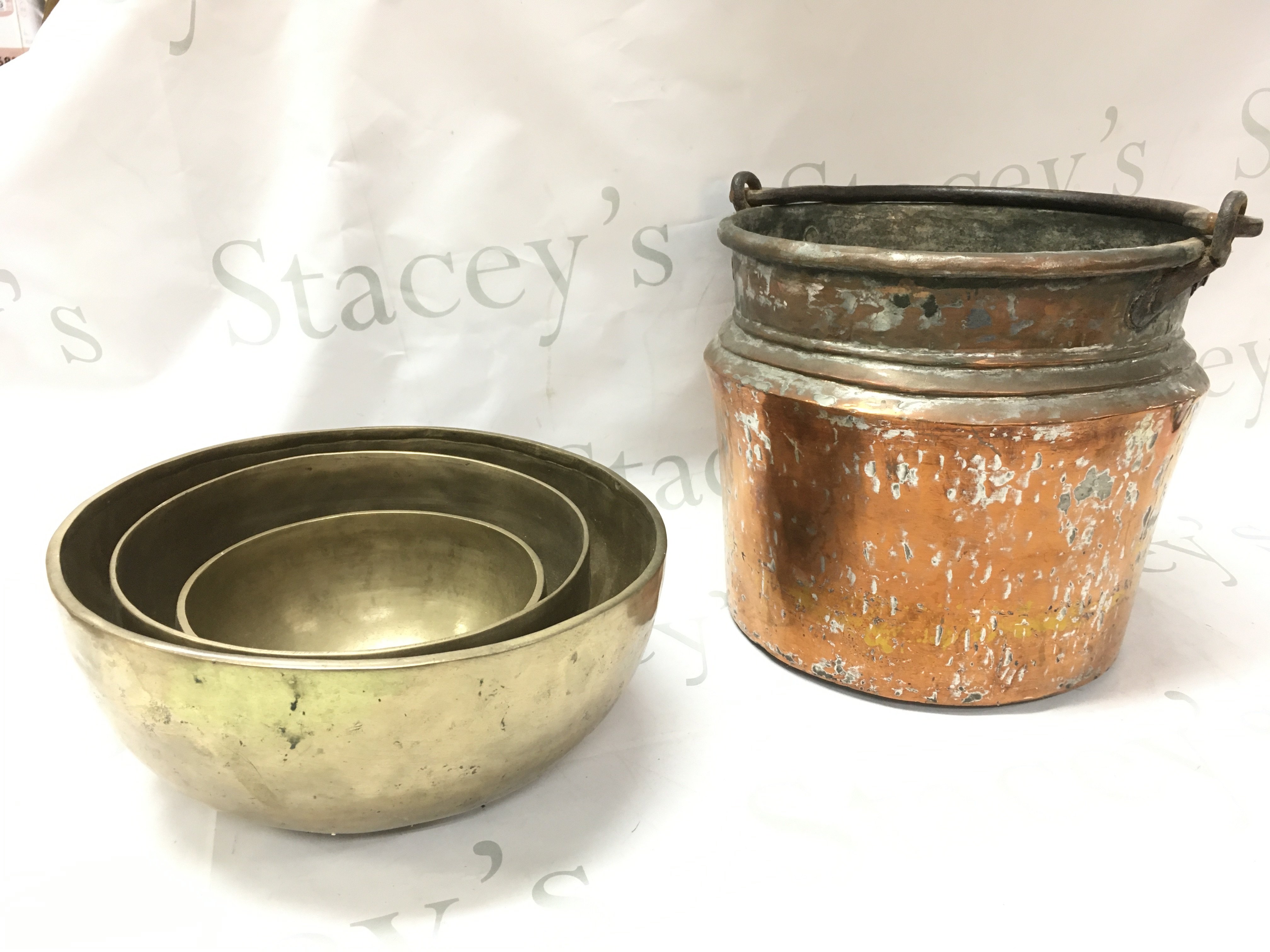 Three bronze bowls (8 to 10cm tall) and a copper skittle (23cm tall) postage category C